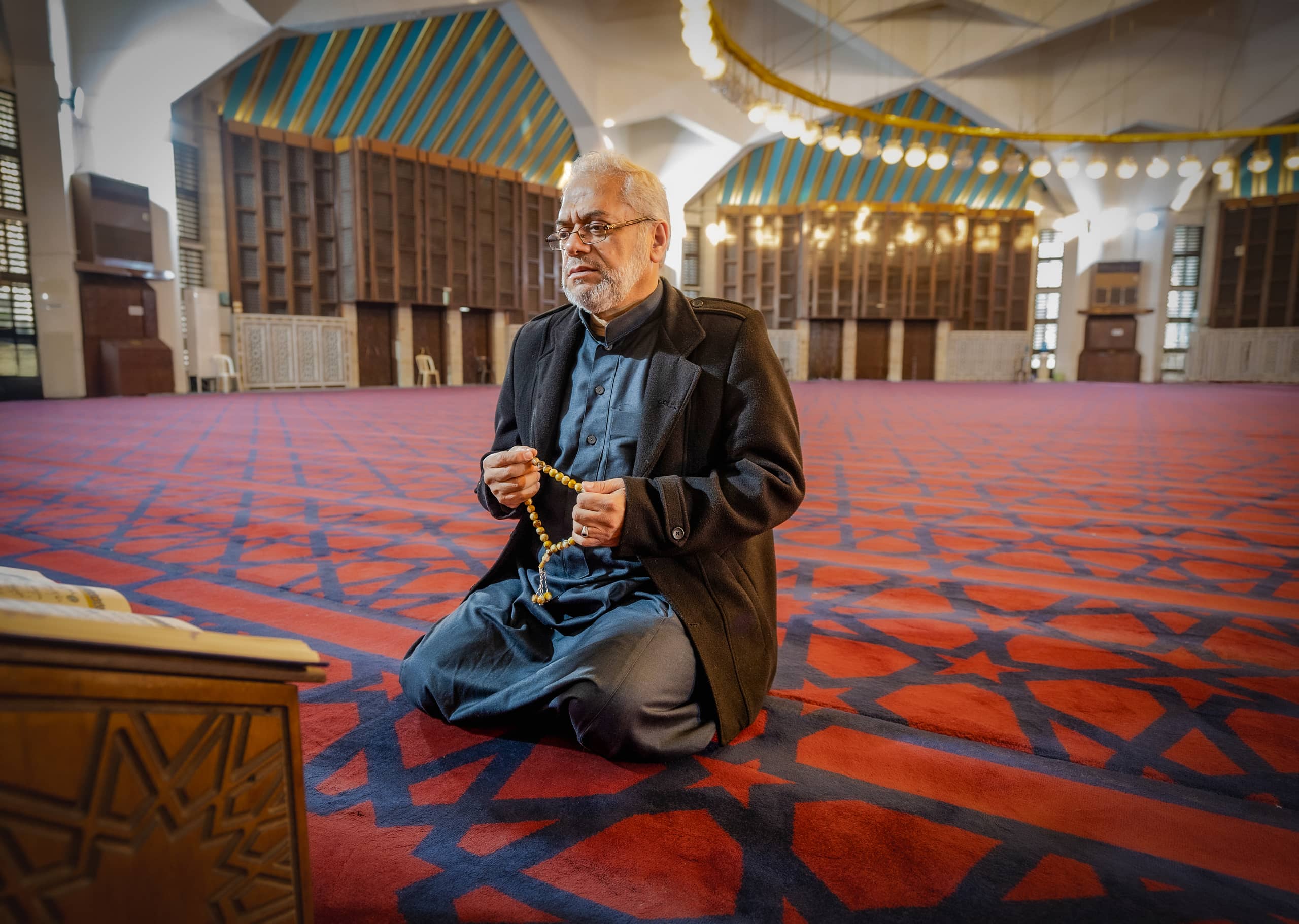 MAN OLD Masjed Pray, a fine-art photograph by Ali Abu Ras