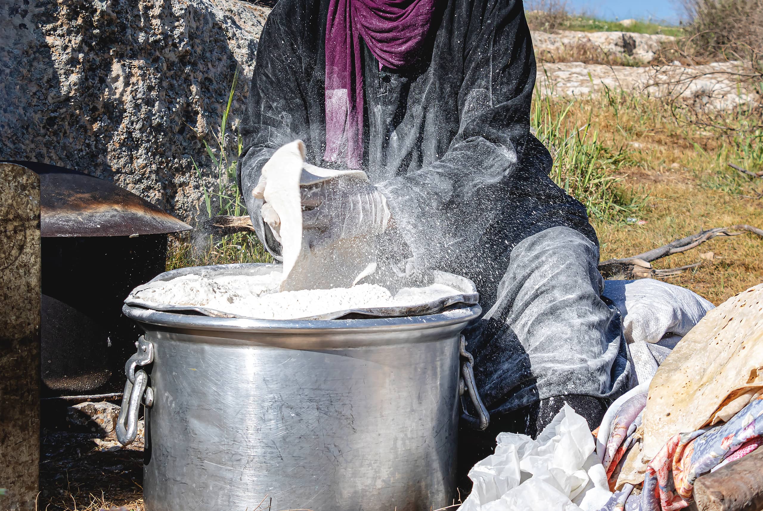 Woman Work Create Bread Outdoor Graesa, a fine-art photograph by Ali Abu Ras