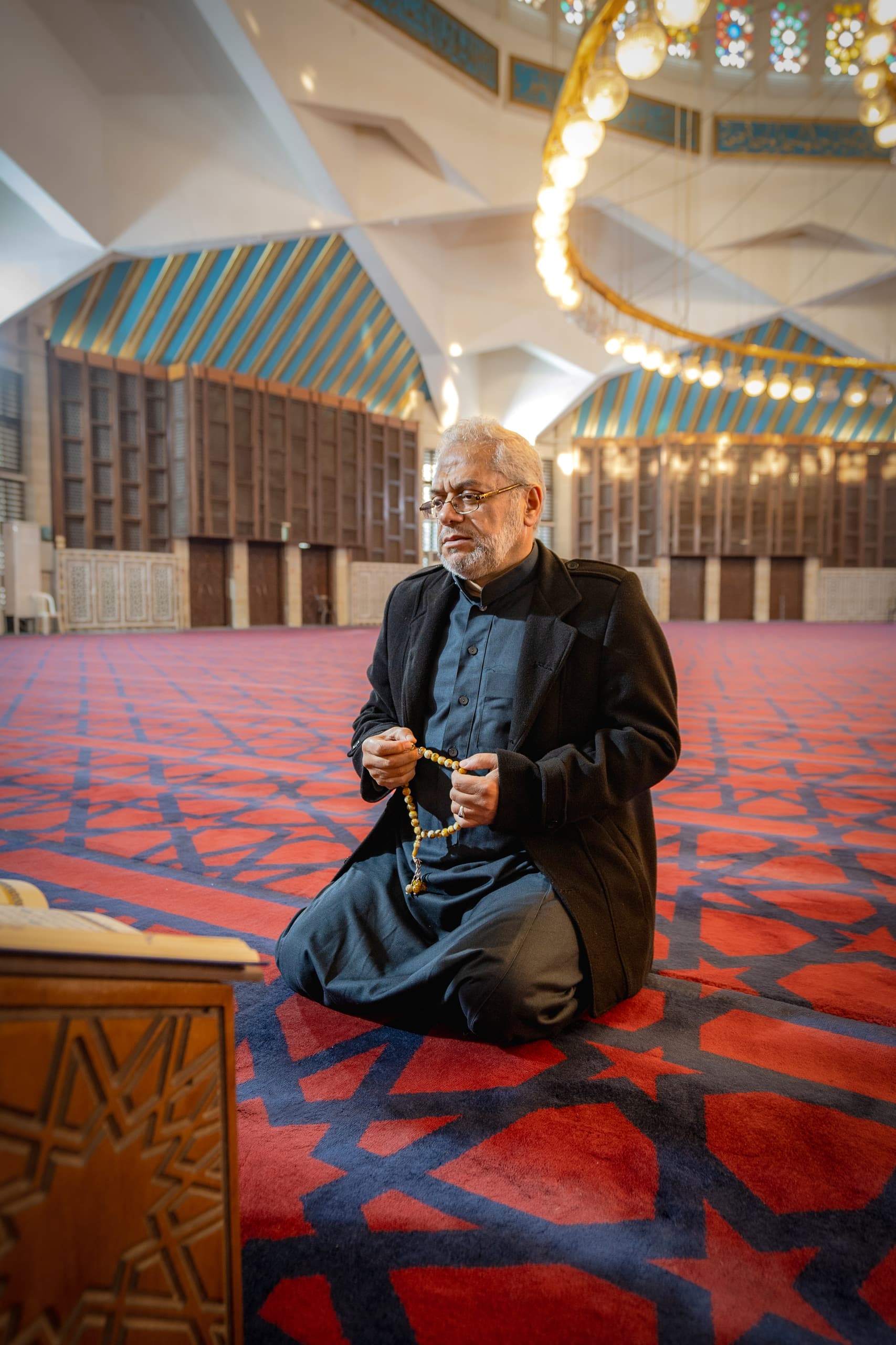 MAN OLD Masjed Pray, a fine-art photograph by Ali Abu Ras