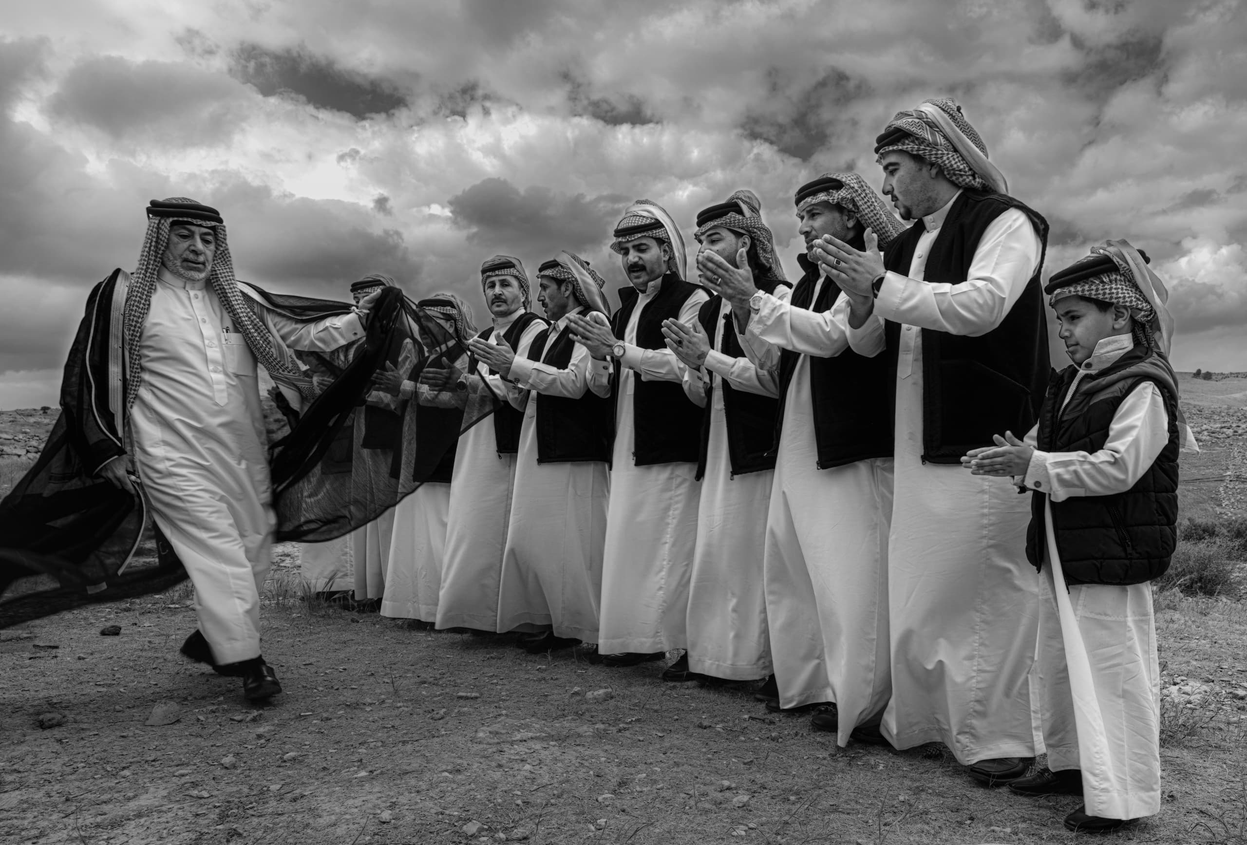 Gharesa Dancing People MEN, a fine-art photograph by Ali Abu Ras
