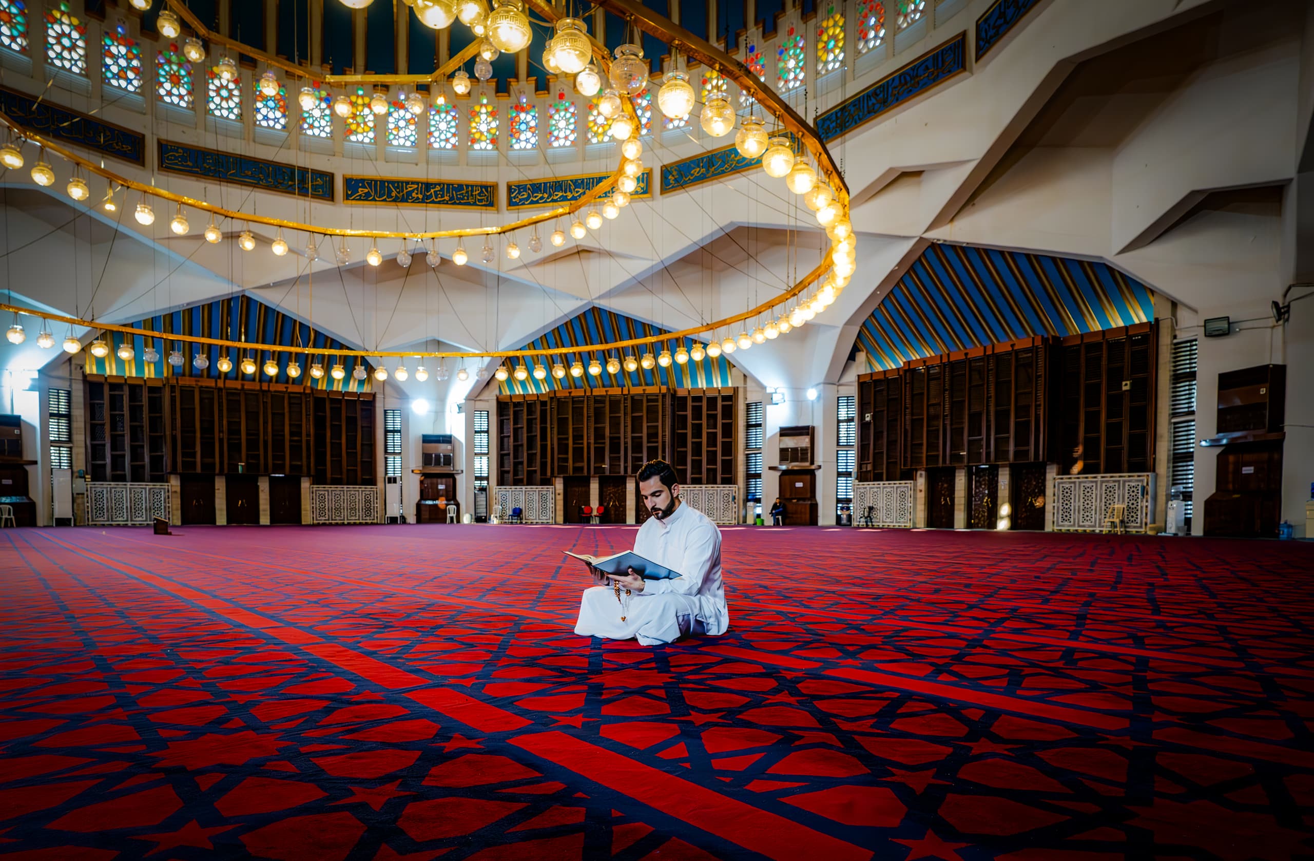 MAN Read Quran Masjid Ramadain Sunlight, a fine-art photograph by Ali Abu Ras