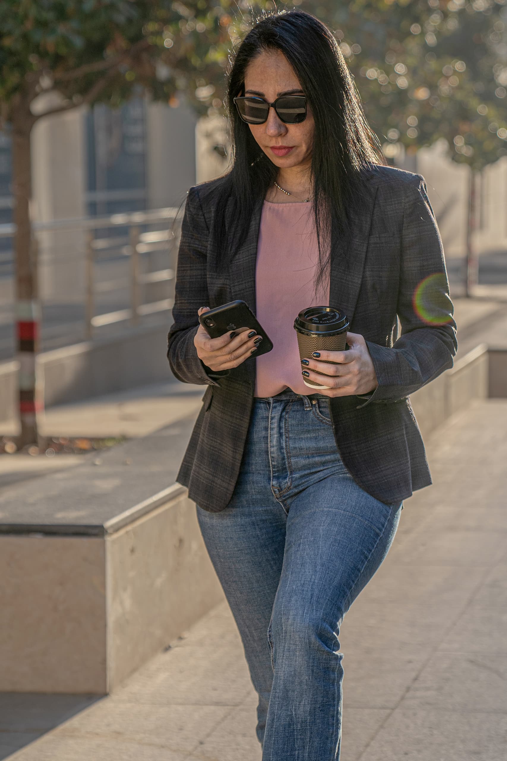 Woman Bolivard Walking, a fine-art photograph by Ali Abu Ras