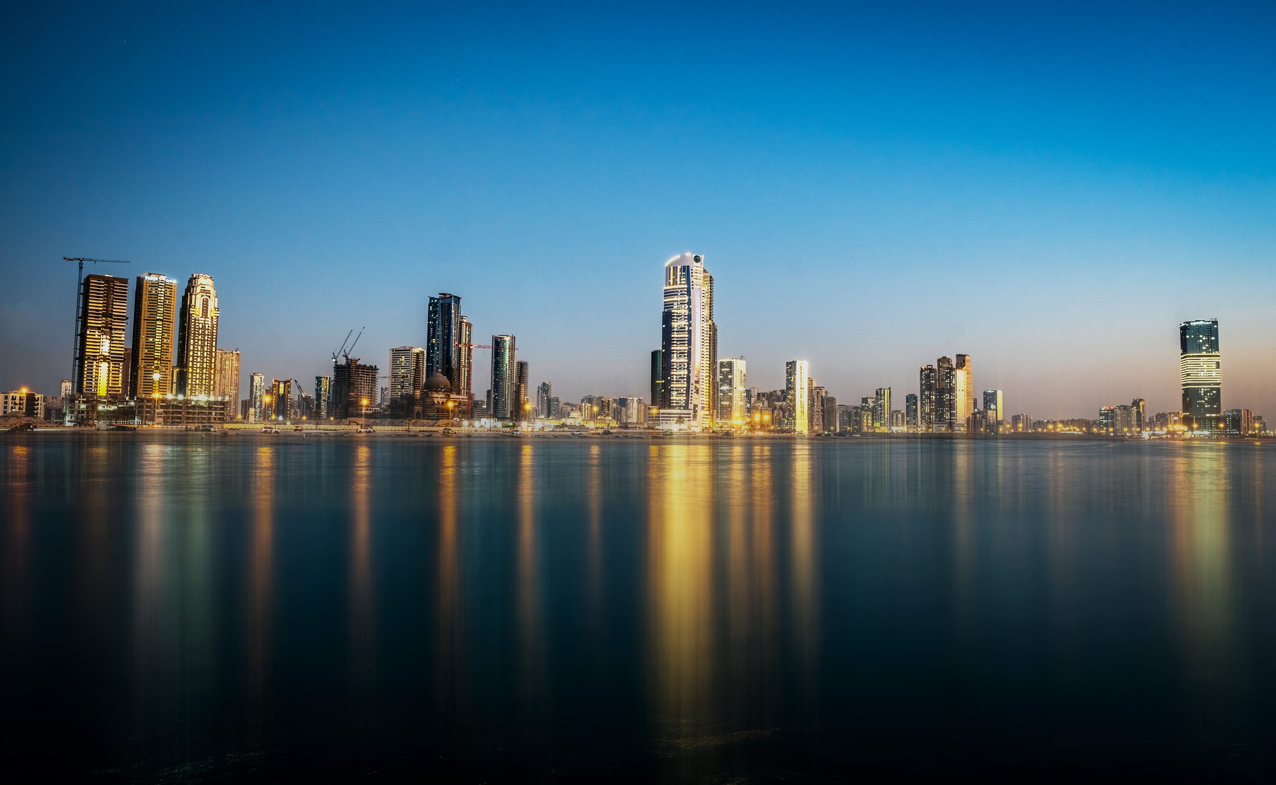 Dubai Alshareqa Building Night Expouer, a fine-art photograph by Ali Abu Ras