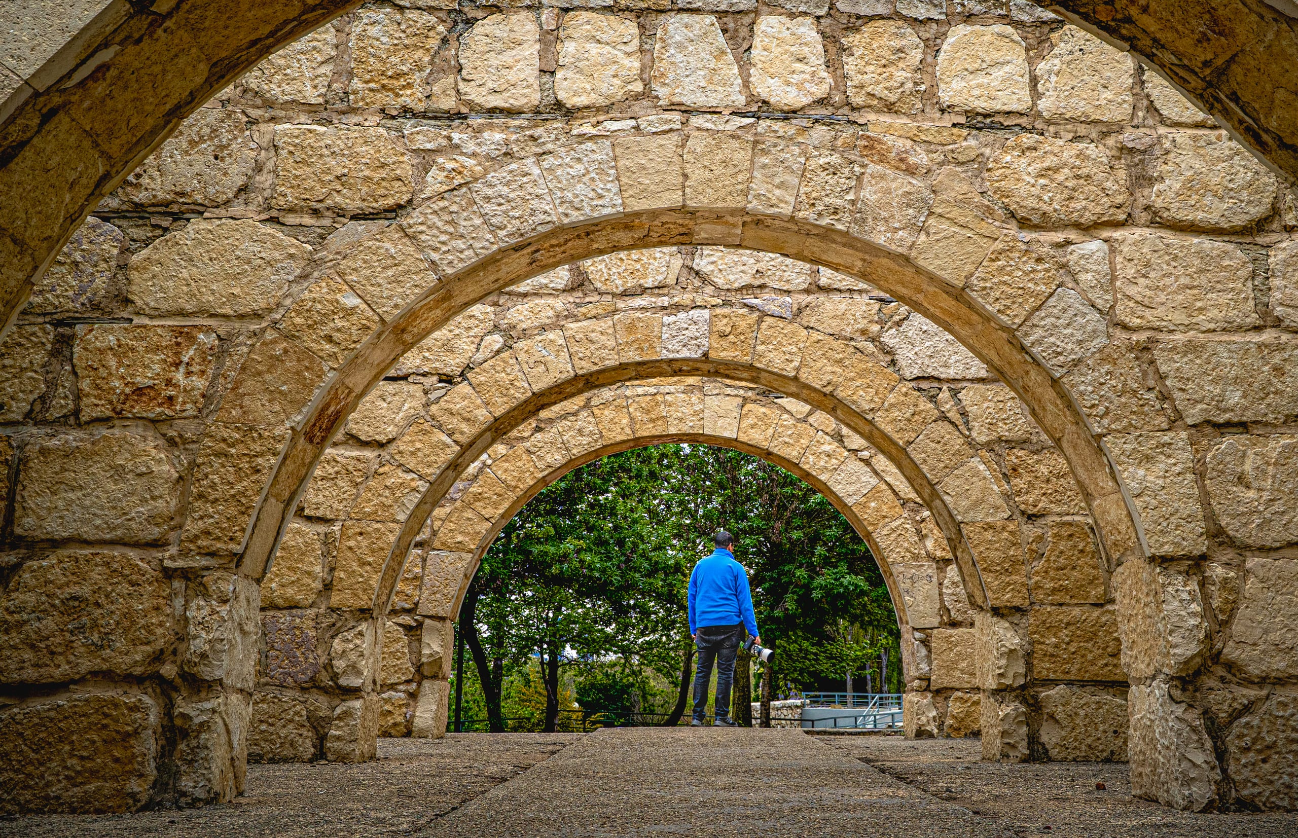 MAN Stand Arches, a fine-art photograph by Ali Abu Ras