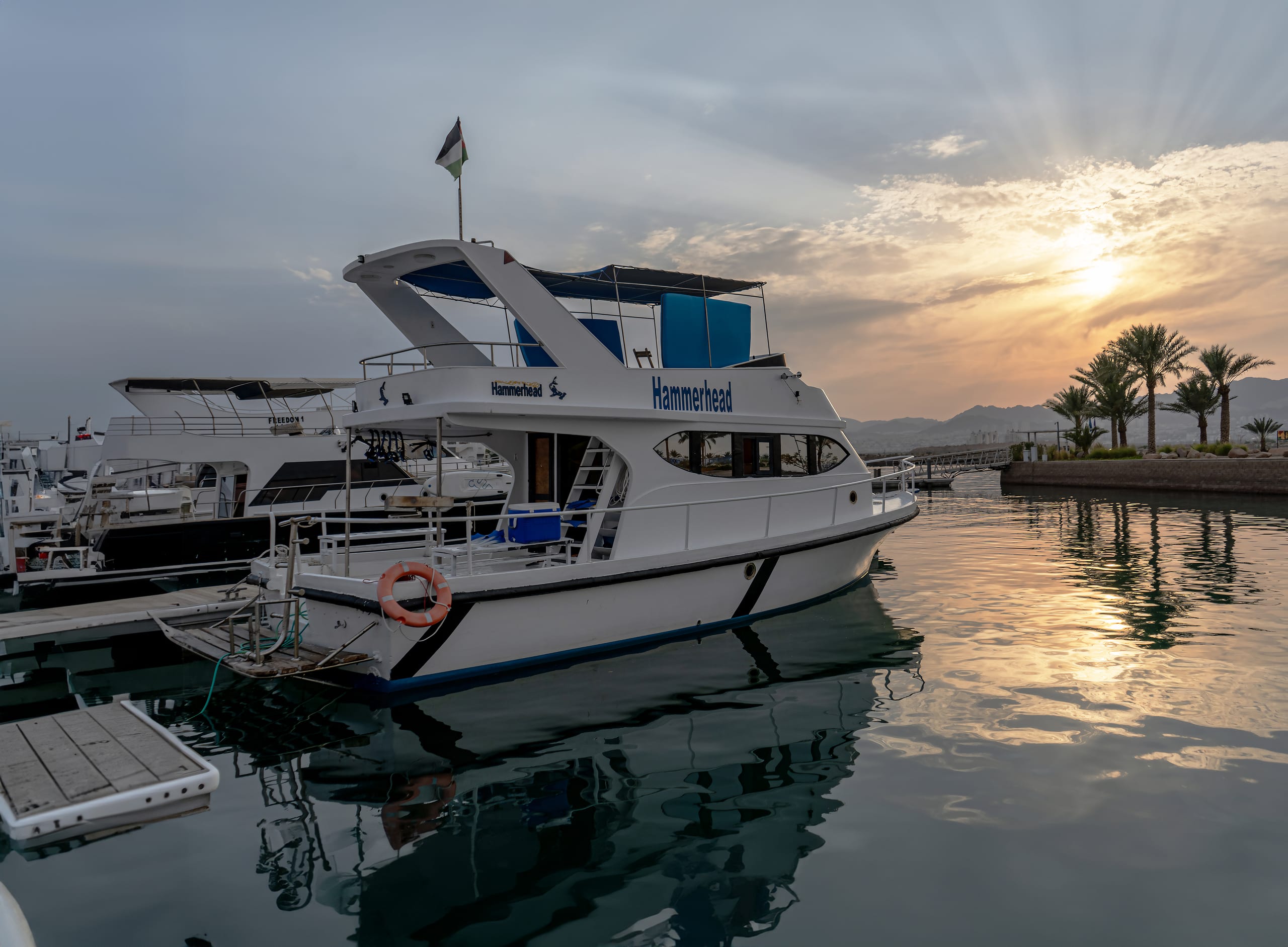 Aqaba SEA Boat Sunset View Landscape, a fine-art photograph by Ali Abu Ras