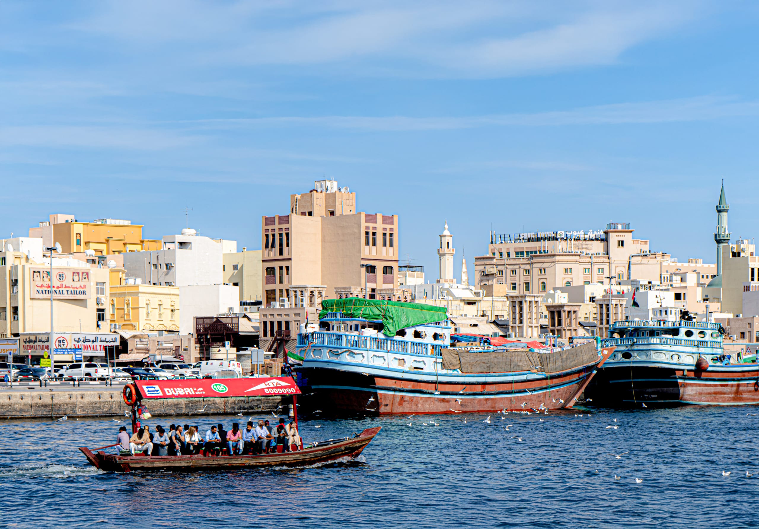 Dubai Boat SEA Building People, a fine-art photograph by Ali Abu Ras