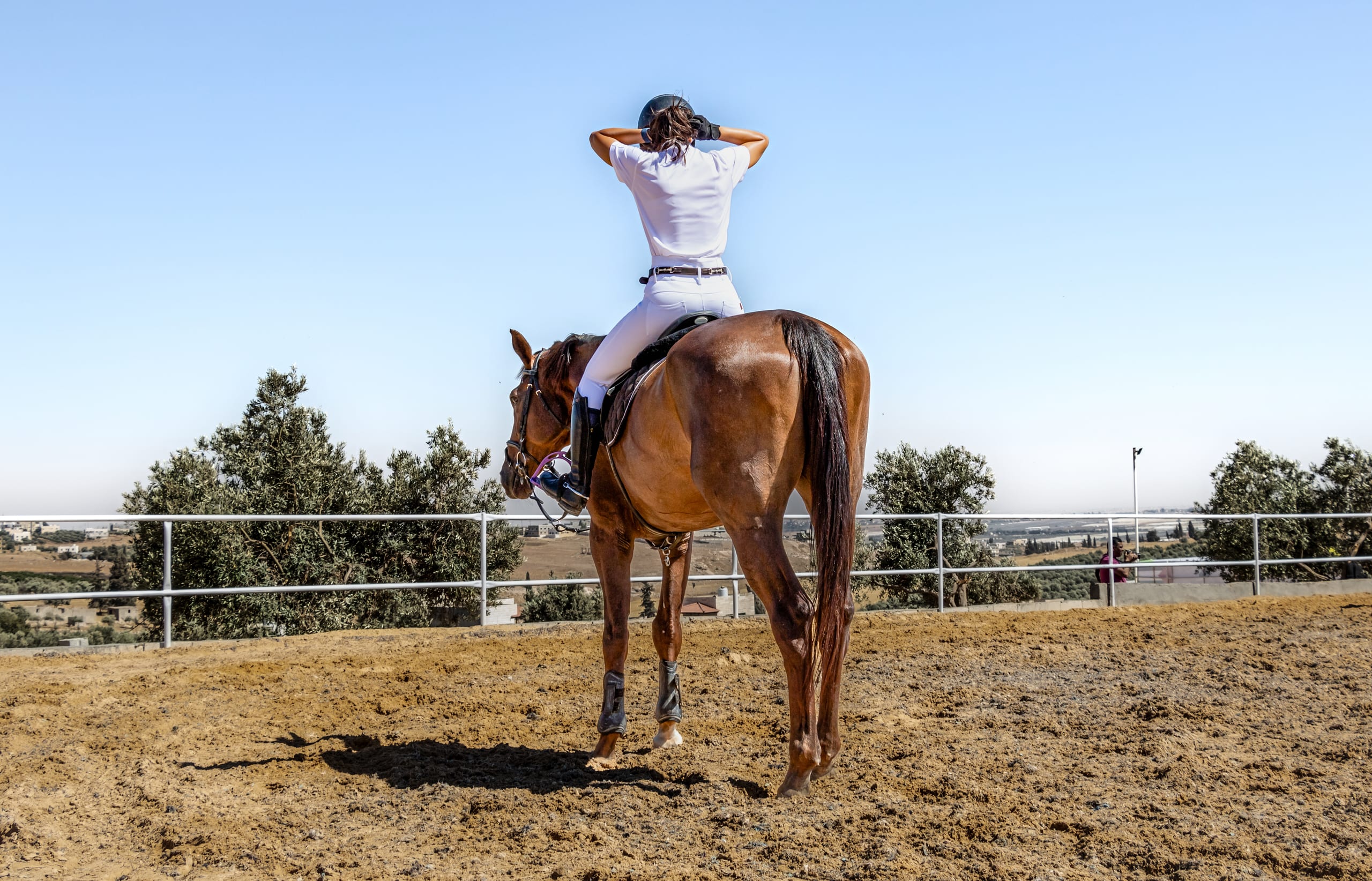 Hours Rider Woman Feild, a fine-art photograph by Ali Abu Ras