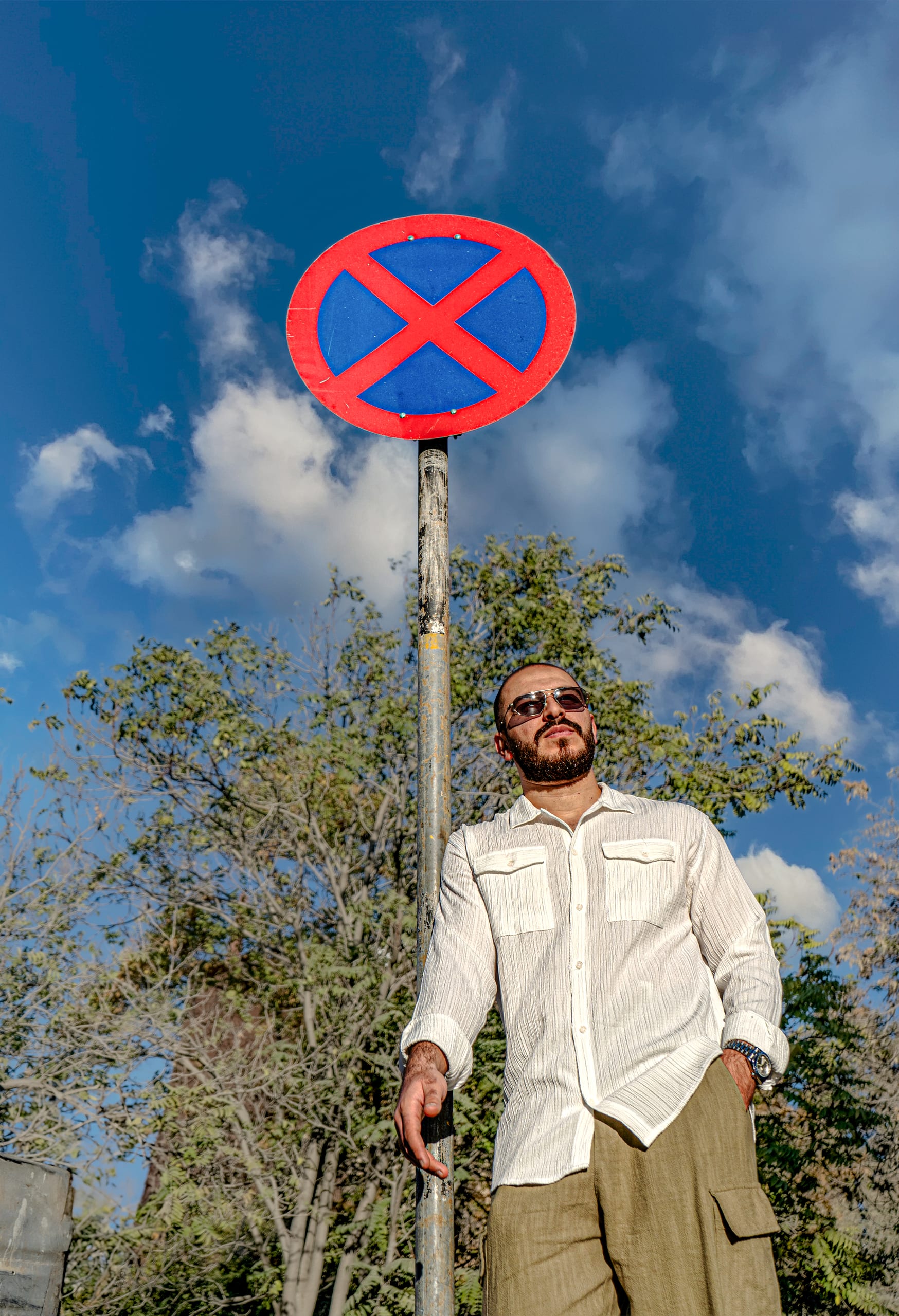 MAN Sign Stand Glass, a fine-art photograph by Ali Abu Ras
