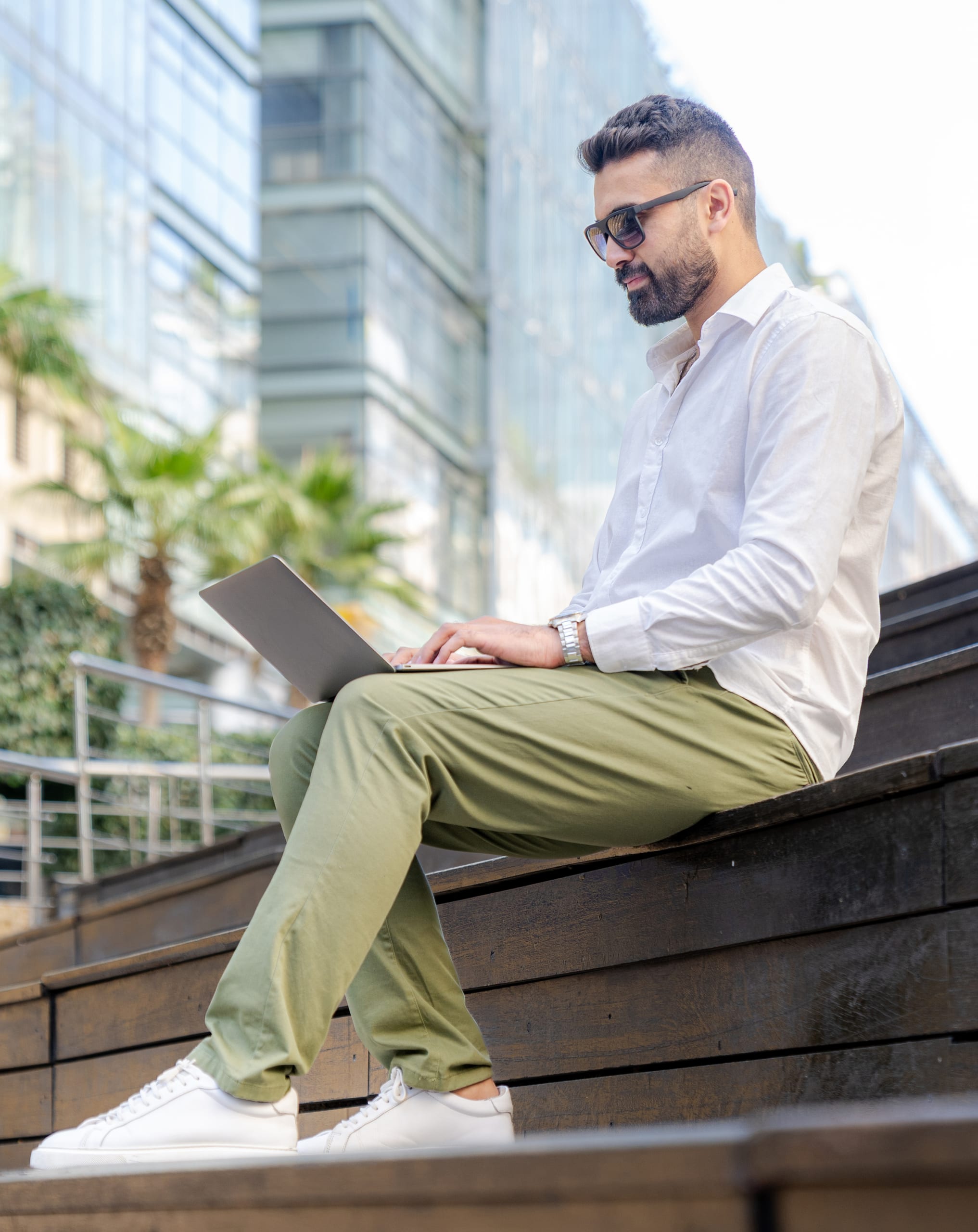 MAN Setting Labtop Building Business, a fine-art photograph by Ali Abu Ras