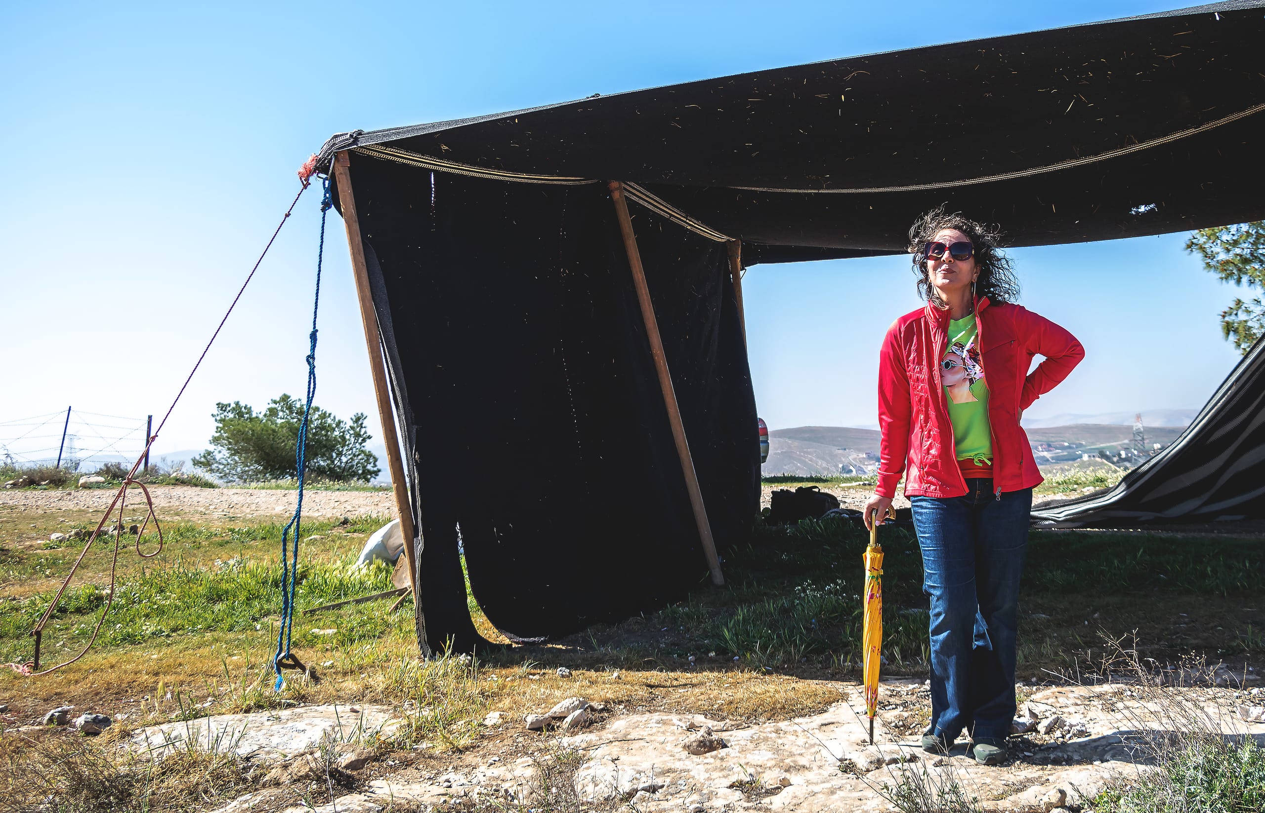 Woman Bedwen Position Tent Garesa, a fine-art photograph by Ali Abu Ras