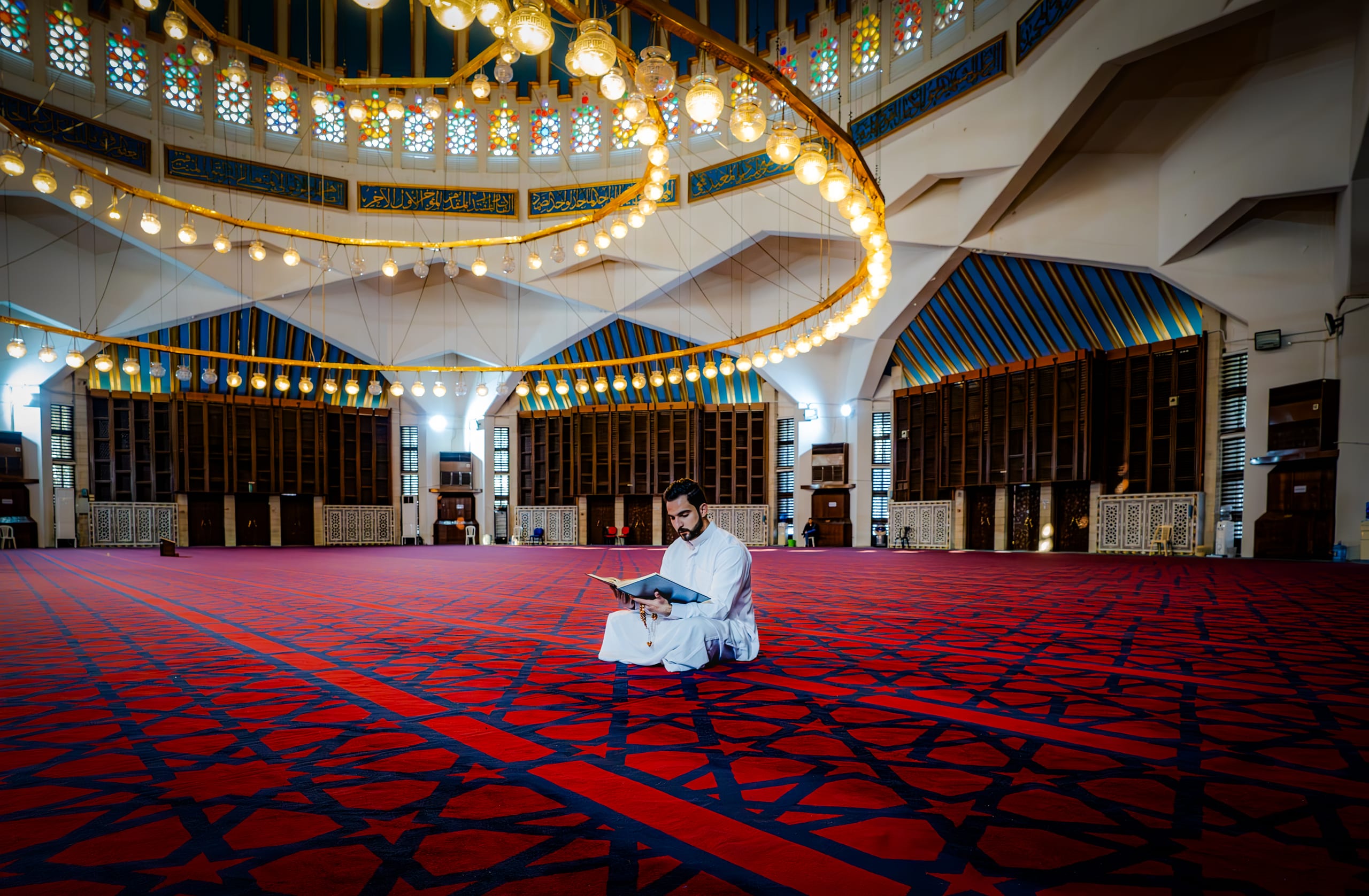 MAN Read Quran Masjid Ramadain Sunlight, a fine-art photograph by Ali Abu Ras
