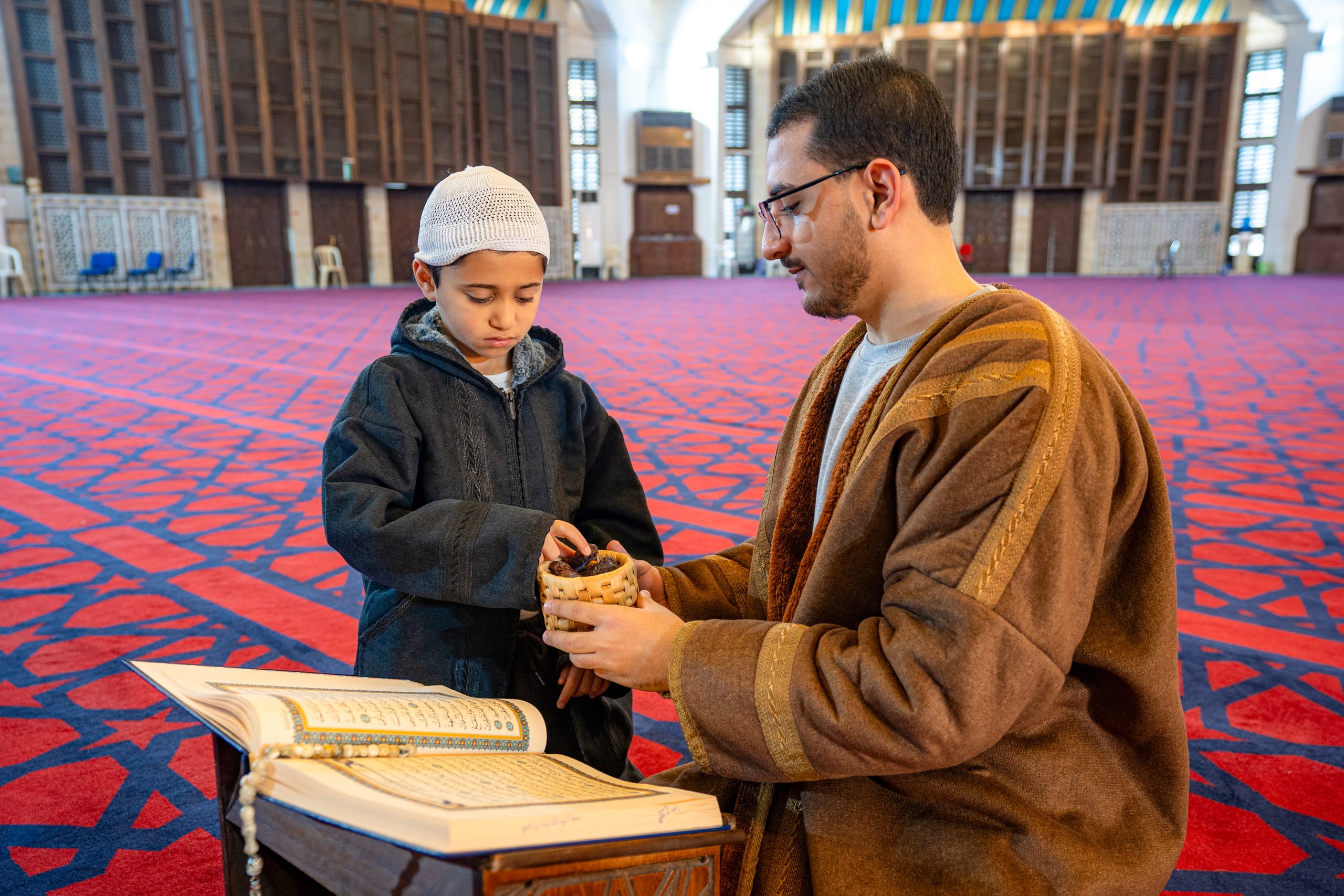 BOY Father Masjed Quran, a fine-art photograph by Ali Abu Ras