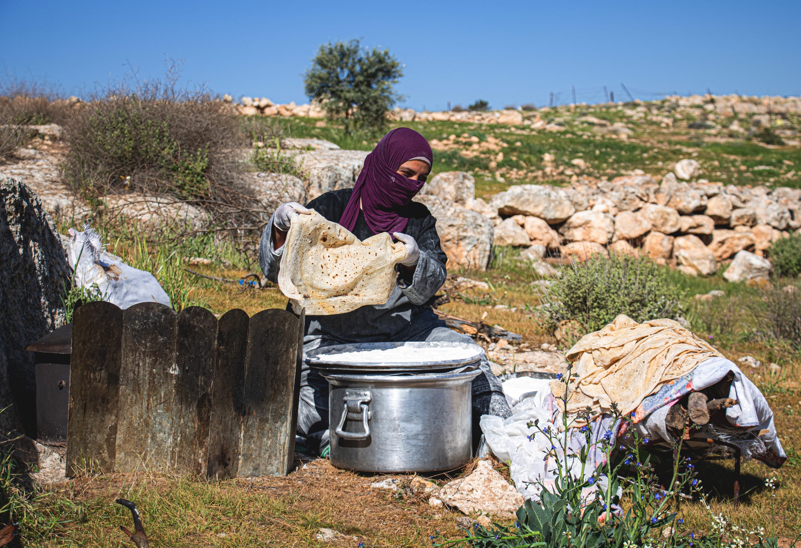 Woman Work Create Bread Outdoor Graesa, a fine-art photograph by Ali Abu Ras