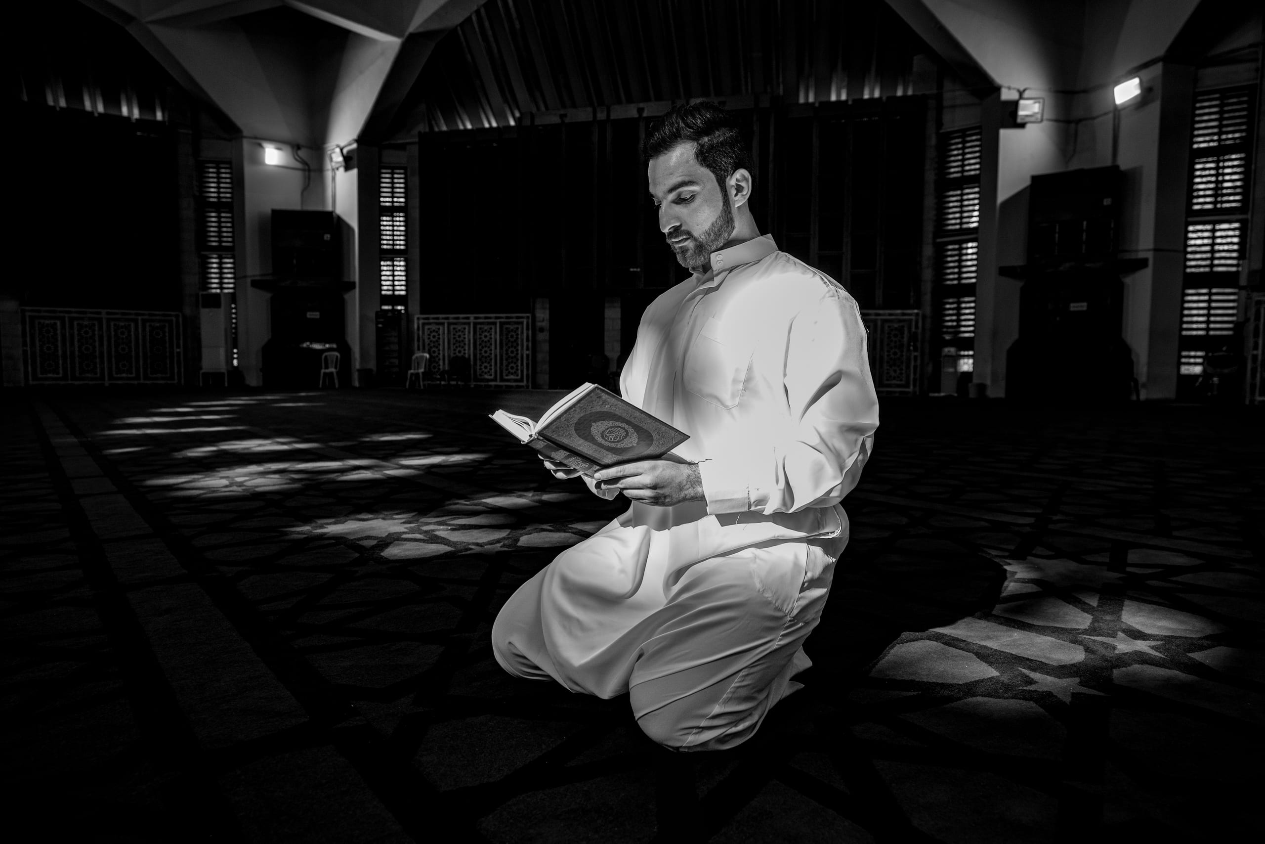MAN Read Quran Masjid Ramadain, a fine-art photograph by Ali Abu Ras