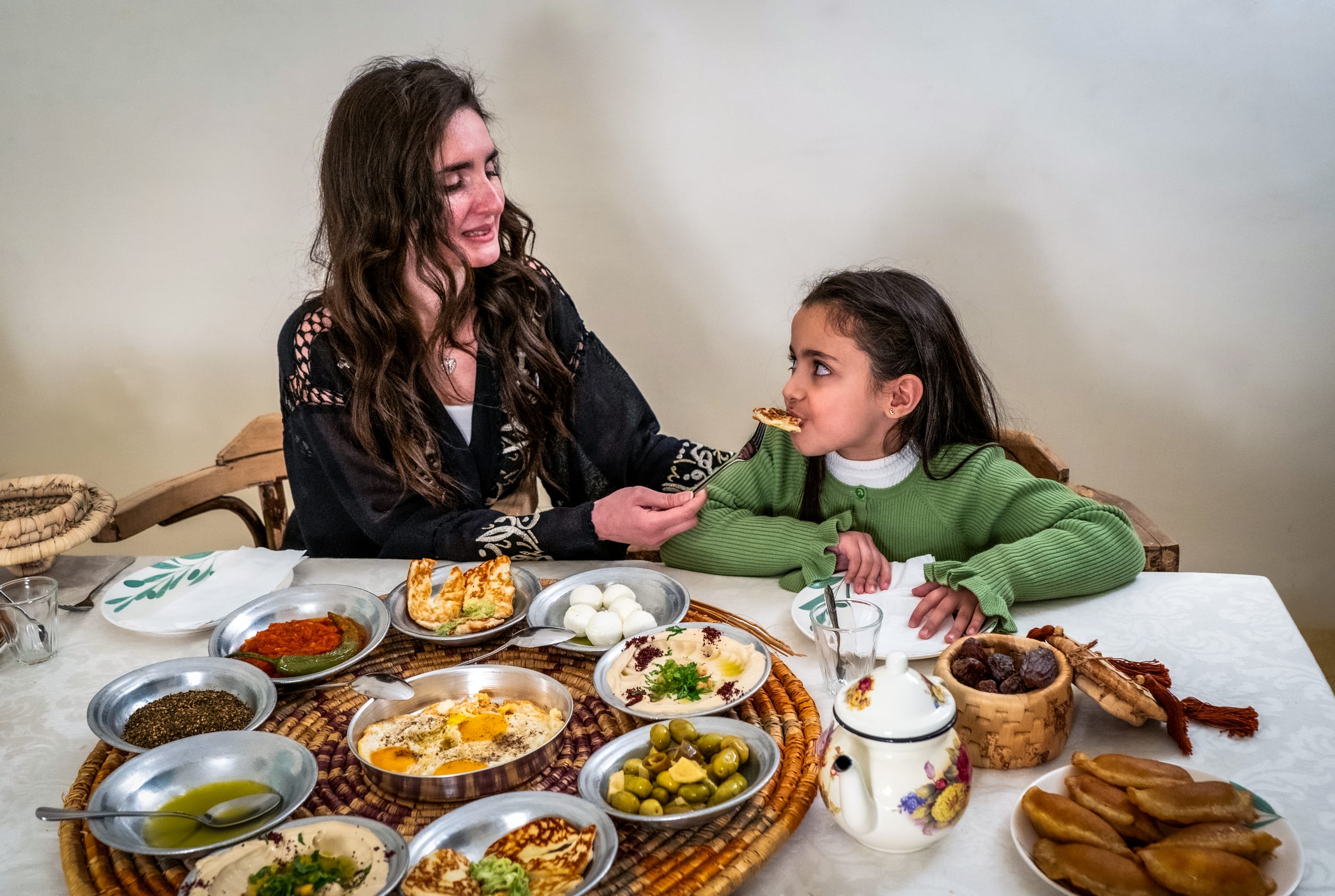 Ramadan Woman Noor Eftar Sohour, a fine-art photograph by Ali Abu Ras