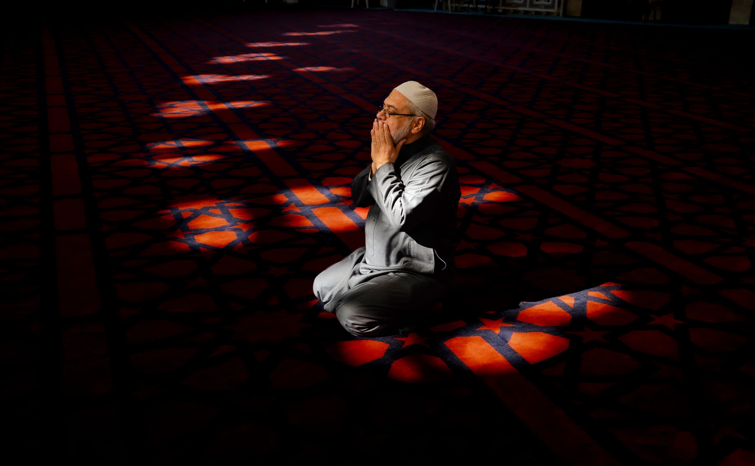MAN Read Quran Masjid Ramadain, a fine-art photograph by Ali Abu Ras