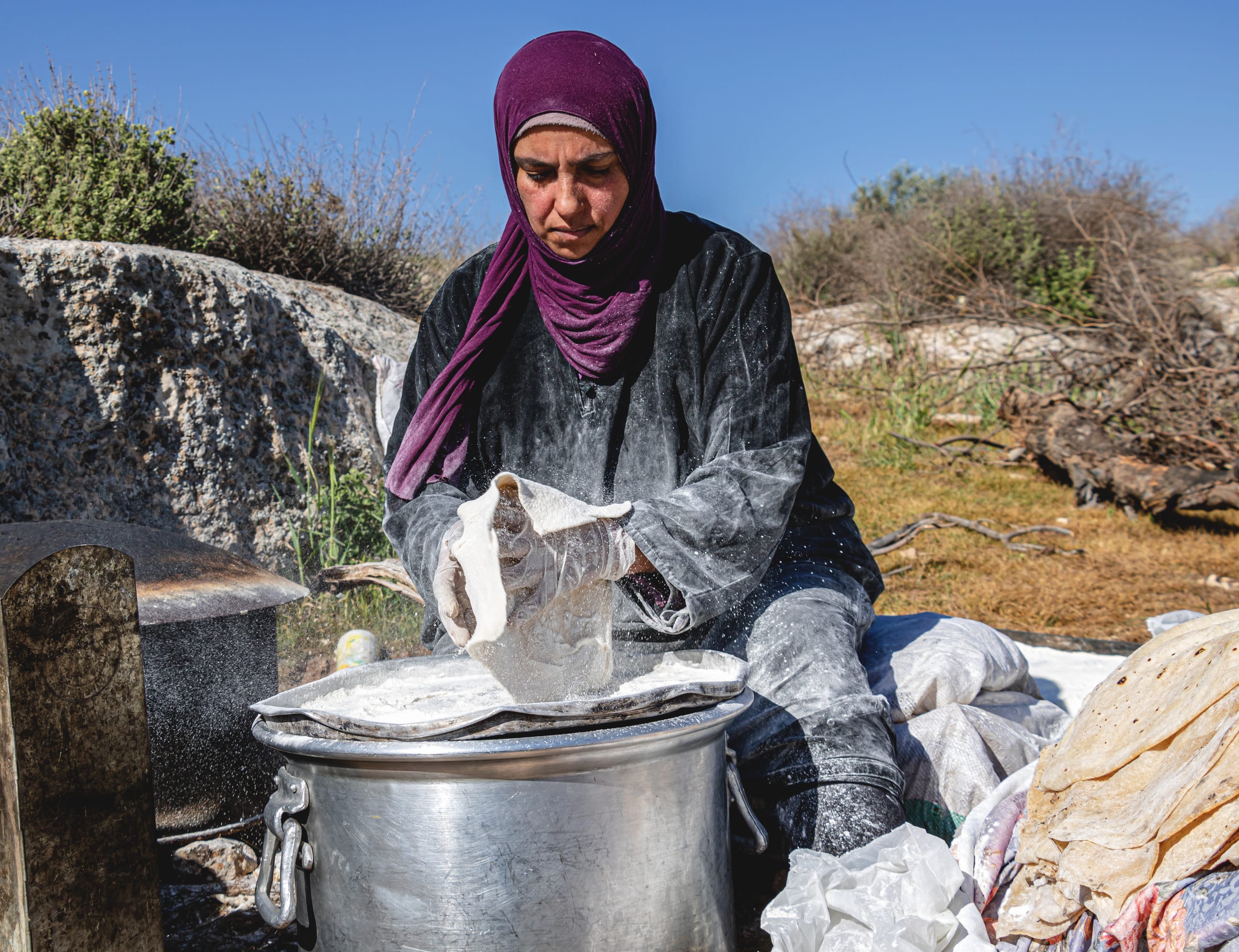 Woman Work Create Bread Outdoor Graesa, a fine-art photograph by Ali Abu Ras