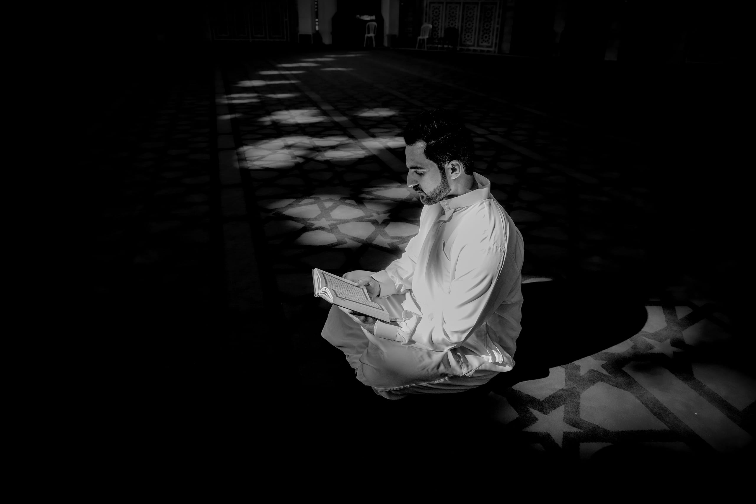 MAN Read Quran Masjid Ramadain, a fine-art photograph by Ali Abu Ras