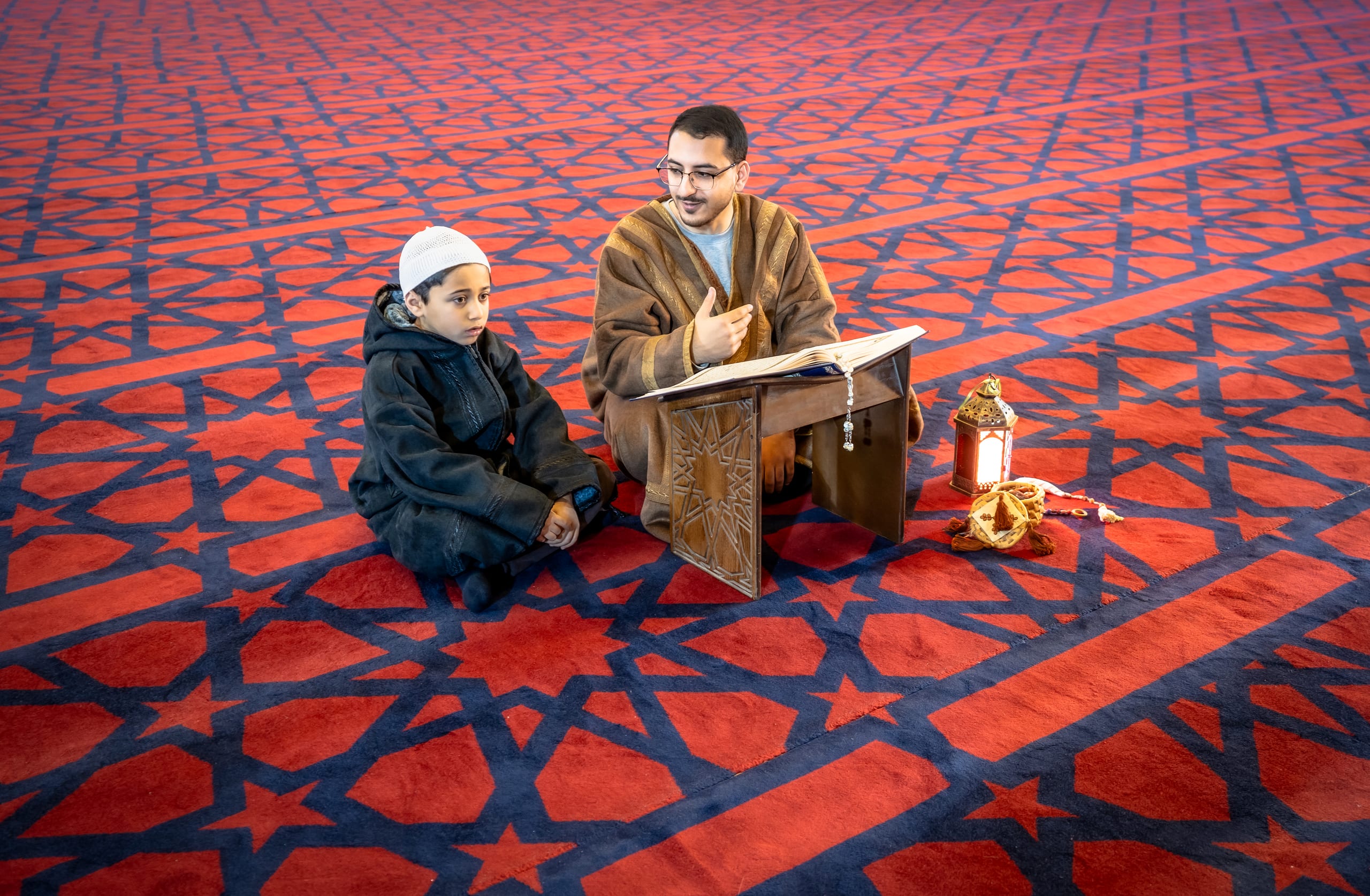 BOY Father Masjed Quran, a fine-art photograph by Ali Abu Ras