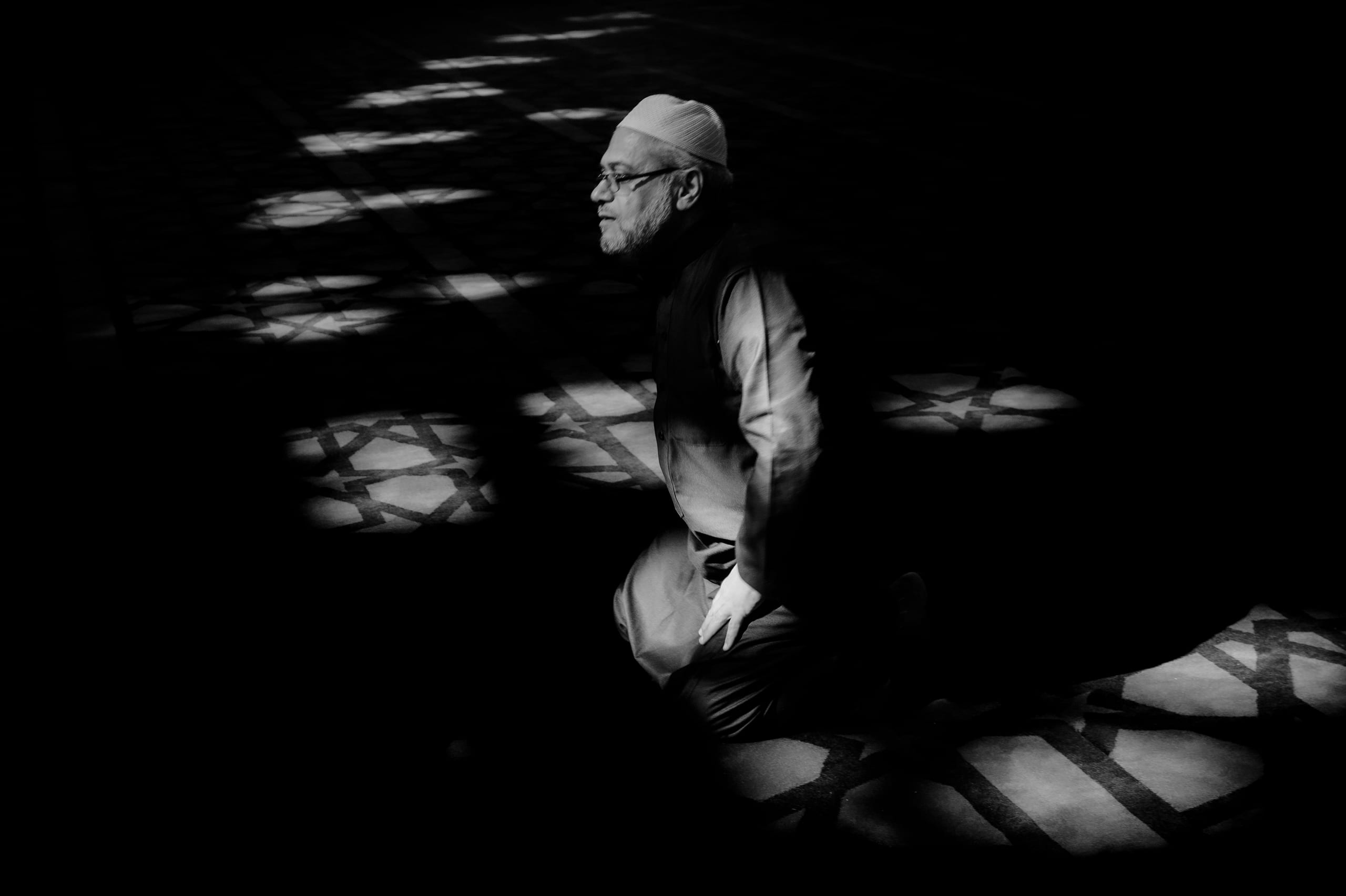 MAN Read Quran Masjid Ramadain, a fine-art photograph by Ali Abu Ras