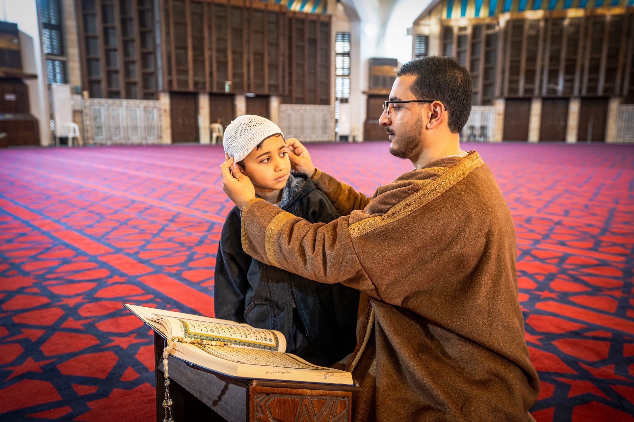 BOY Father Masjed Quran, a fine-art photograph by Ali Abu Ras