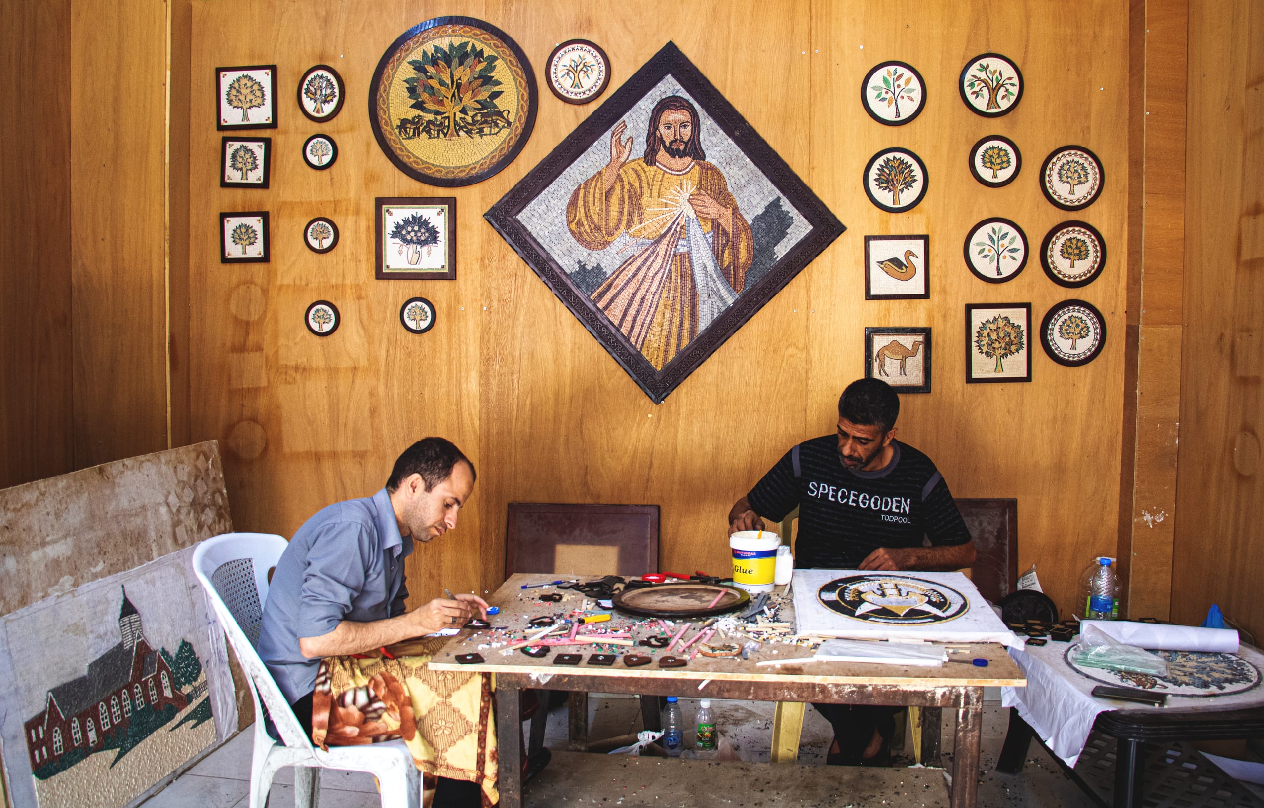 Madaba Street Store People, a fine-art photograph by Ali Abu Ras