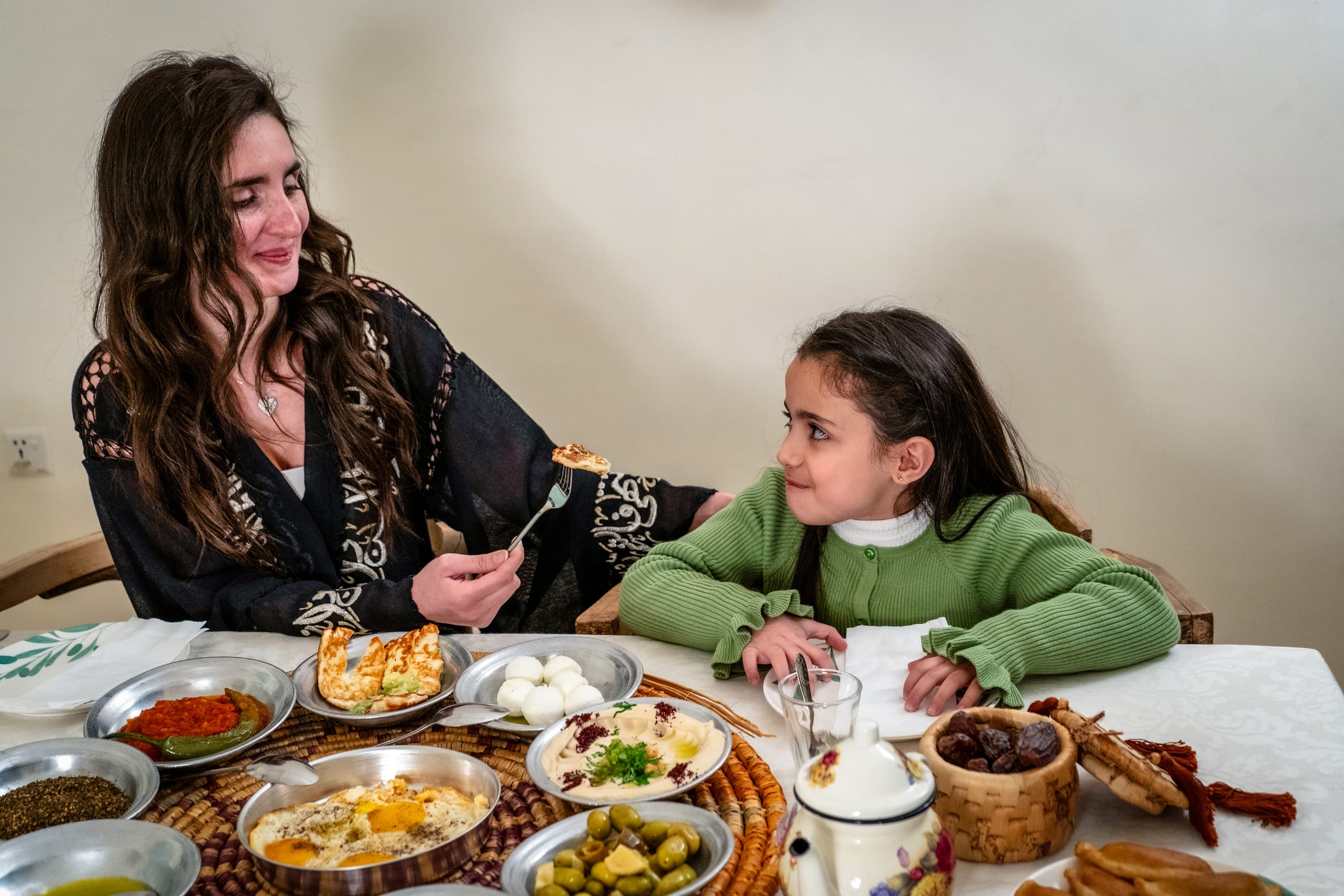 Ramadan Woman Noor Eftar Sohour, a fine-art photograph by Ali Abu Ras