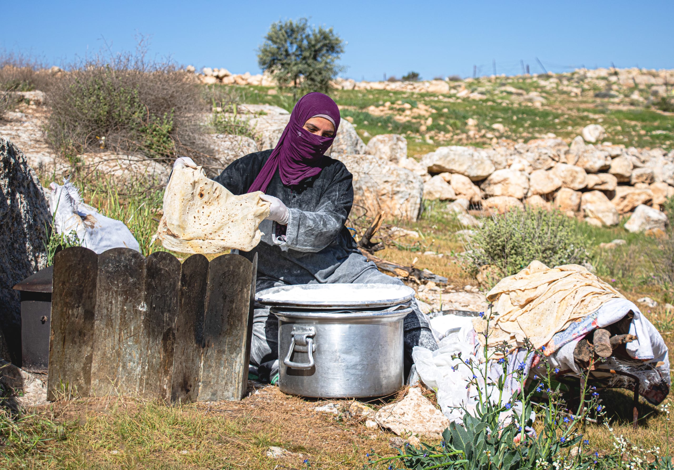 Woman Work Create Bread Outdoor Graesa, a fine-art photograph by Ali Abu Ras