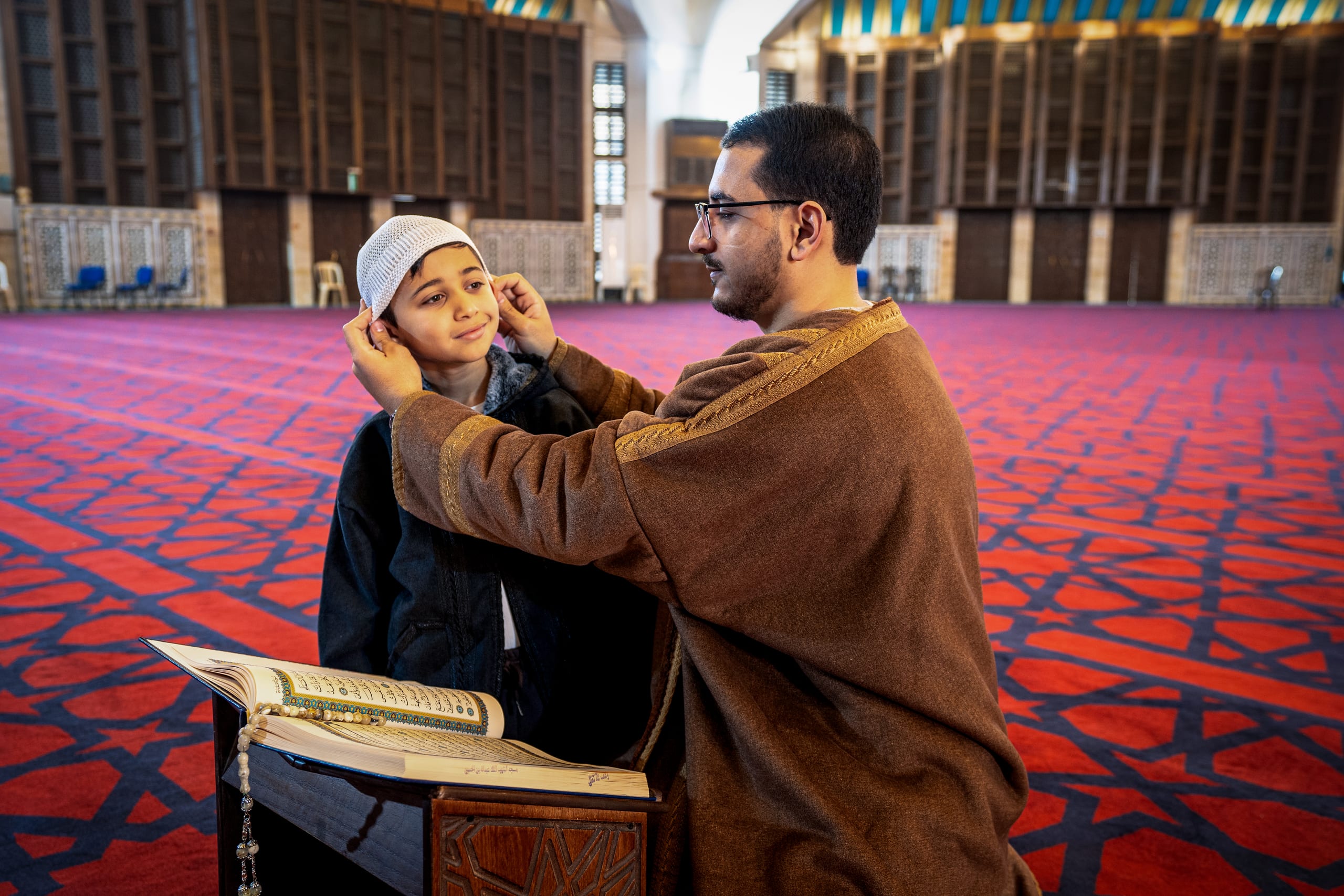 BOY Father Masjed Quran, a fine-art photograph by Ali Abu Ras