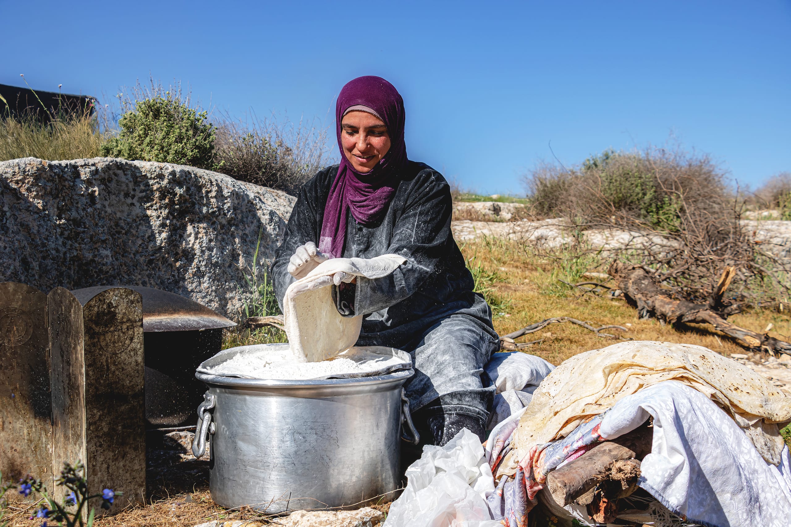 Woman Work Create Bread Outdoor Graesa, a fine-art photograph by Ali Abu Ras