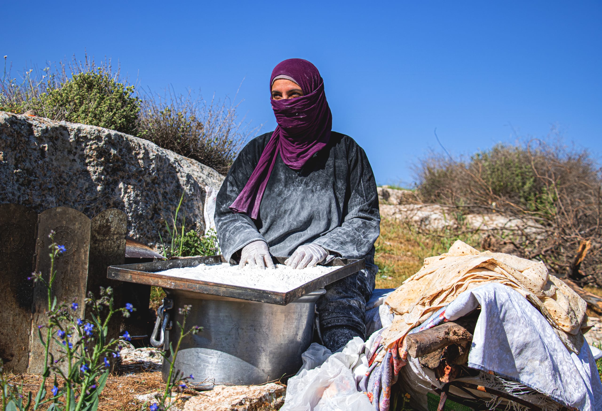 Woman Work Create Bread Outdoor Graesa, a fine-art photograph by Ali Abu Ras