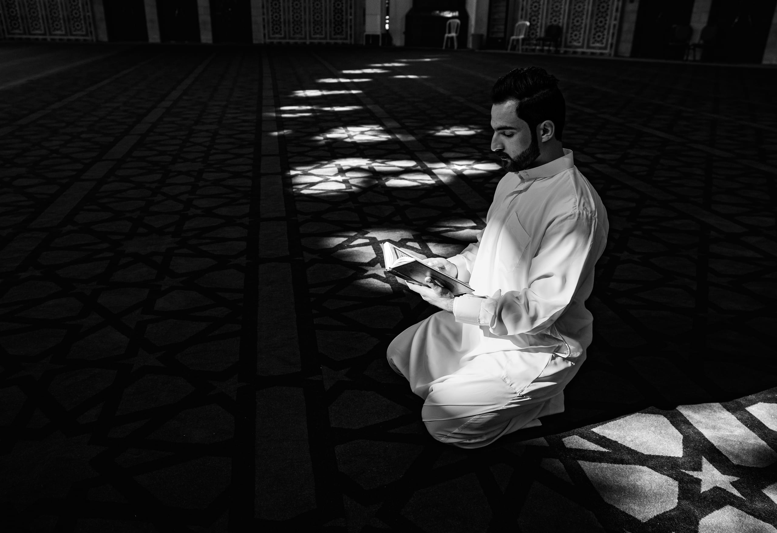 MAN Read Quran Masjid Ramadain, a fine-art photograph by Ali Abu Ras