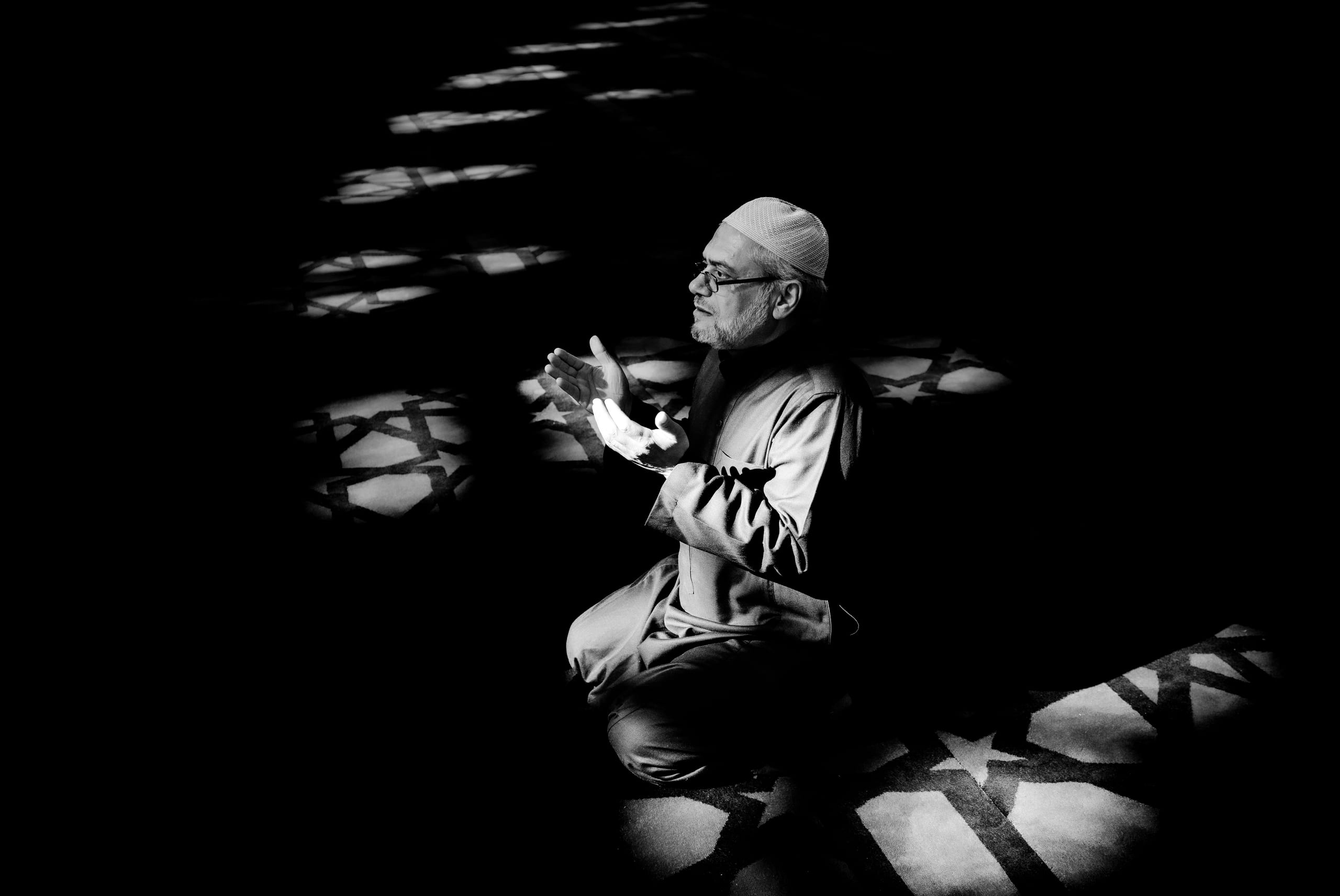 MAN Read Quran Masjid Ramadain, a fine-art photograph by Ali Abu Ras