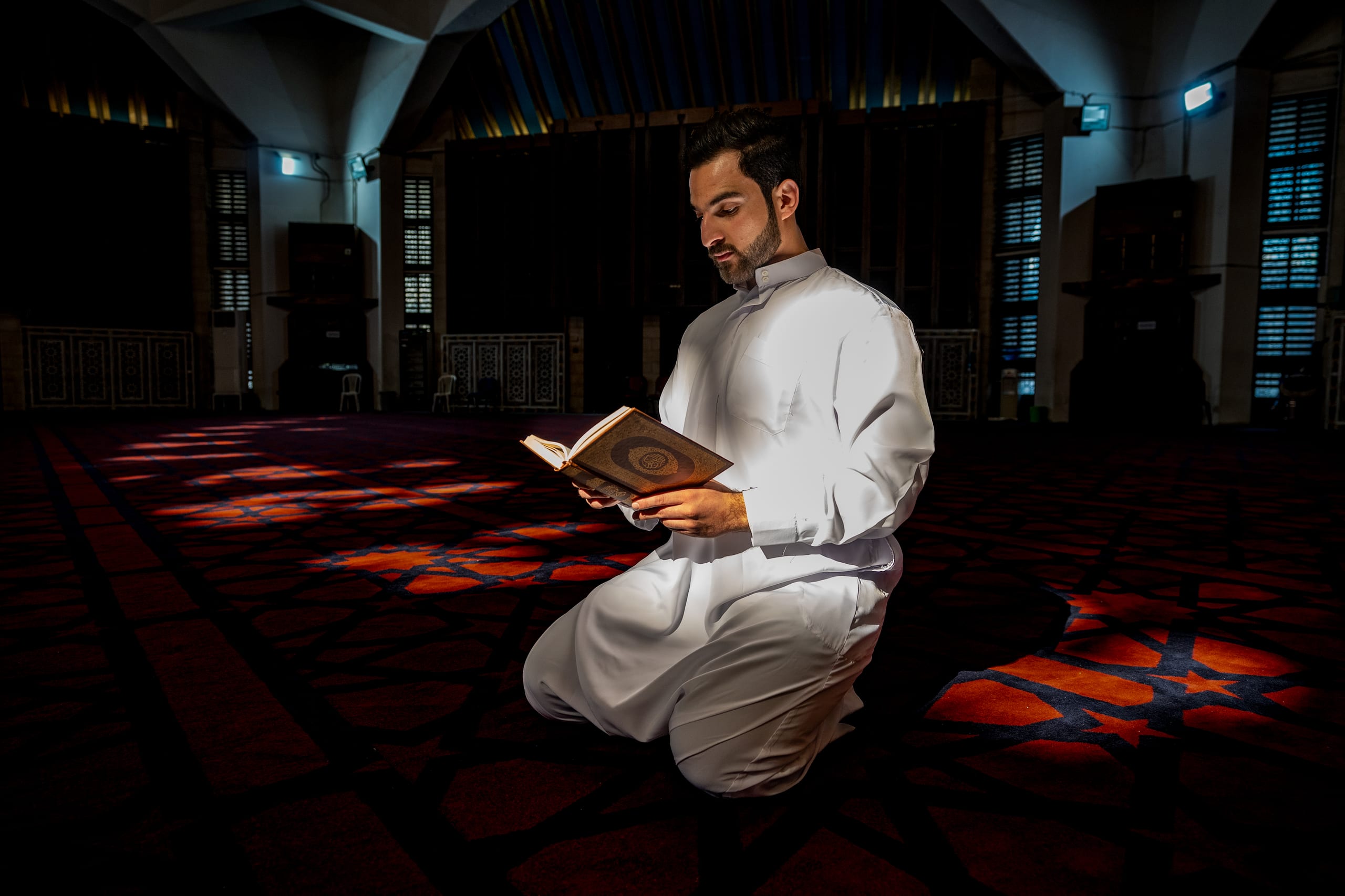 MAN Read Quran Masjid Ramadain, a fine-art photograph by Ali Abu Ras