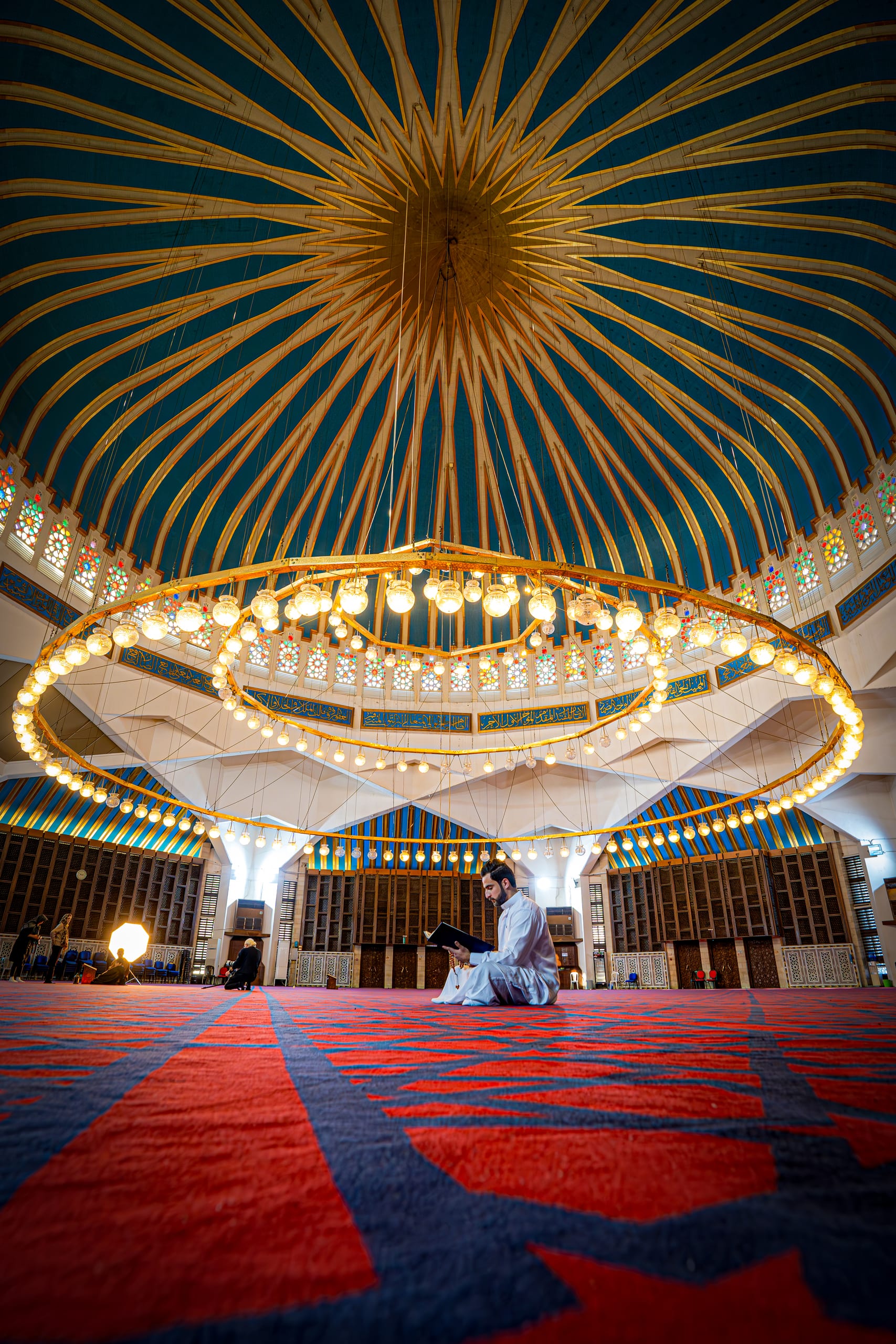 MAN Read Quran Masjid Ramadain Sunlight, a fine-art photograph by Ali Abu Ras
