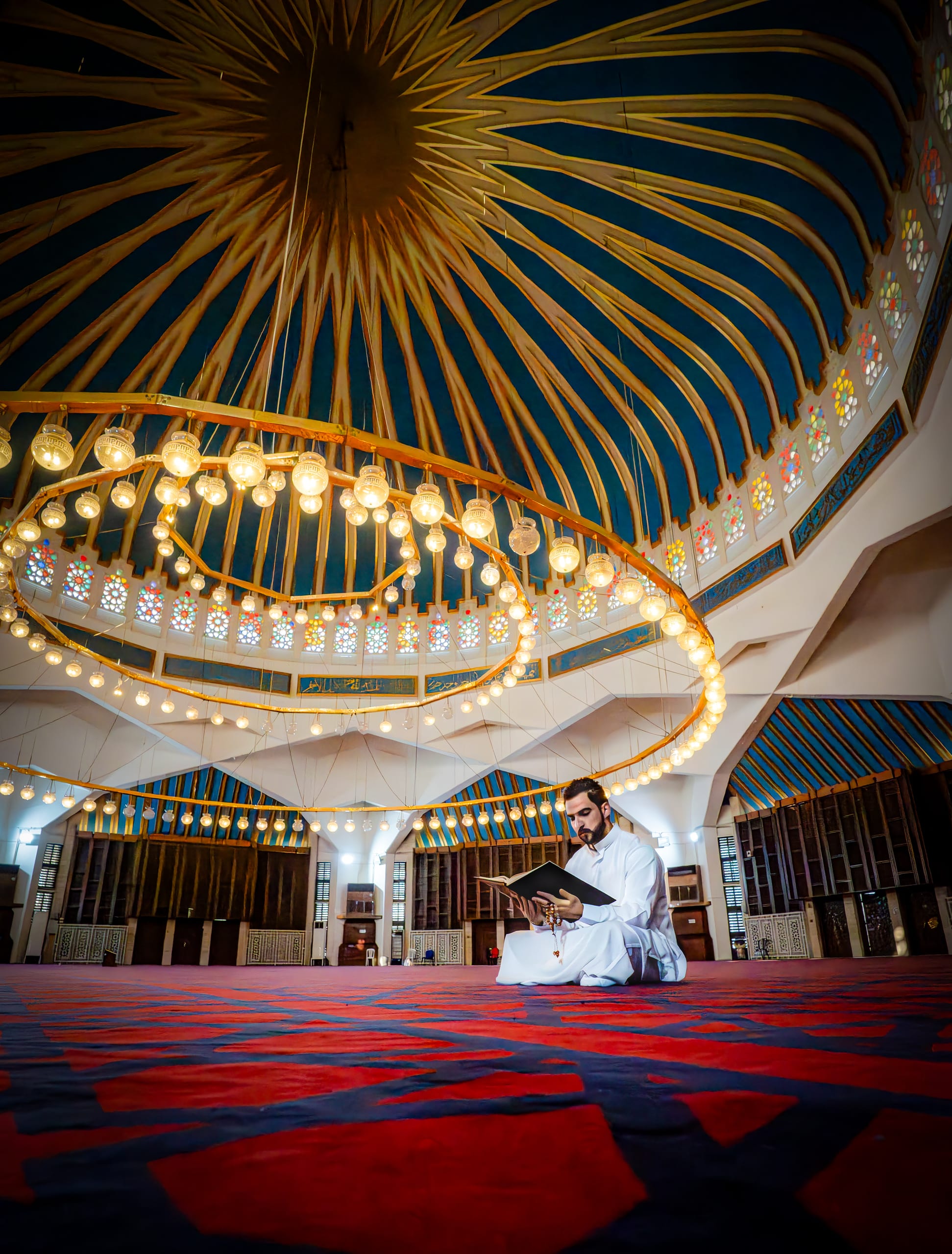 MAN Read Quran Masjid Ramadain Sunlight, a fine-art photograph by Ali Abu Ras