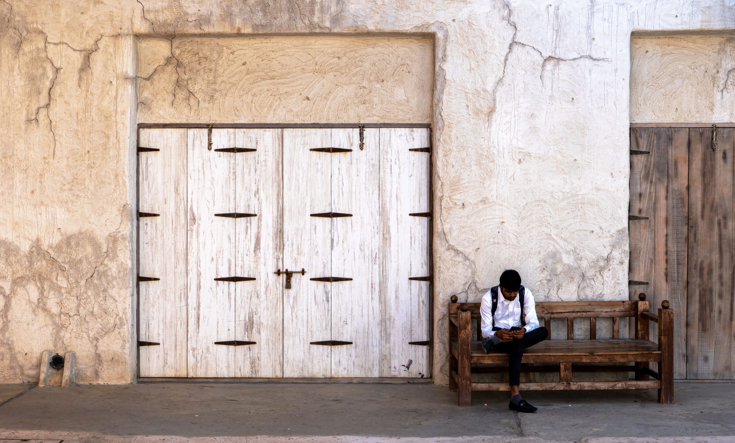 Dubai OLD Place MAN Setting Small People Street, a fine-art photograph by Ali Abu Ras