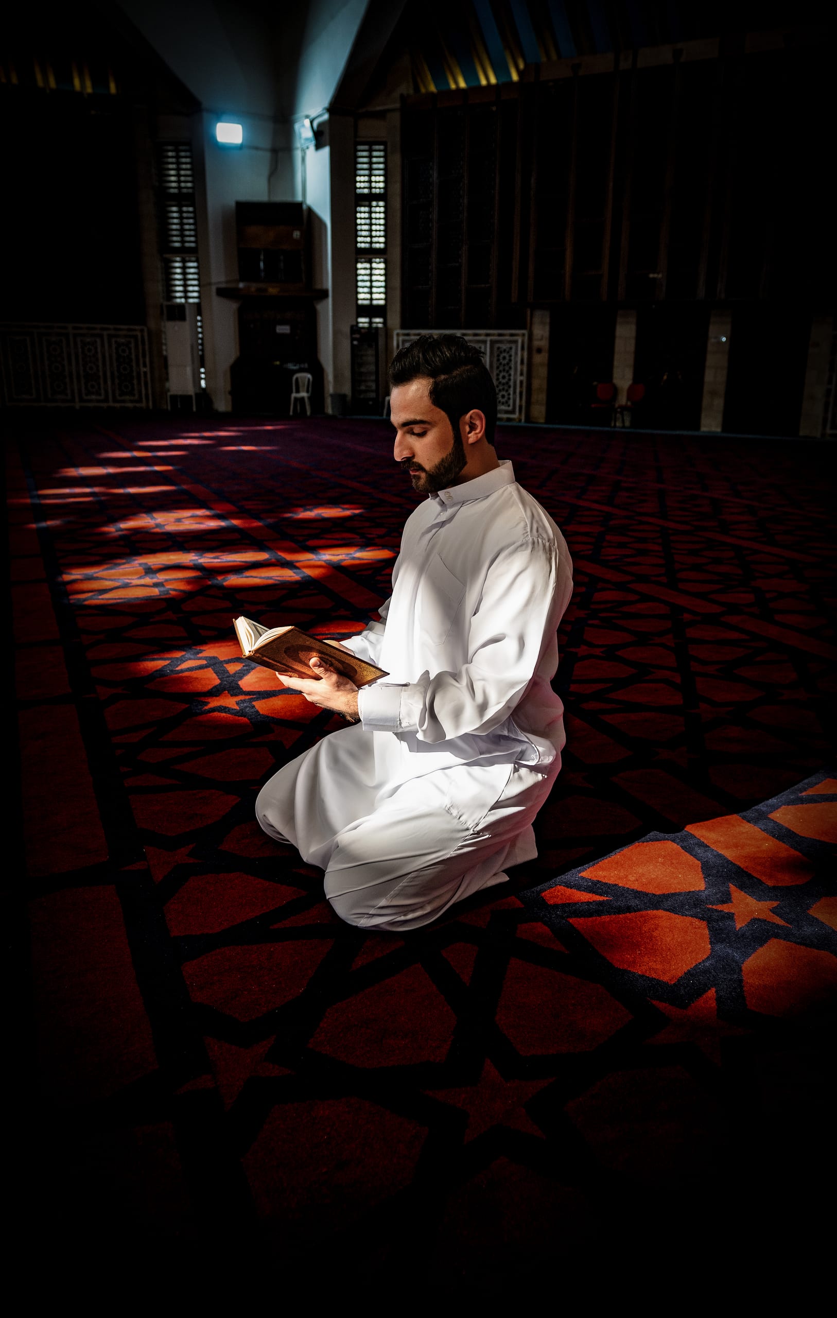 MAN Read Quran Masjid Ramadain, a fine-art photograph by Ali Abu Ras