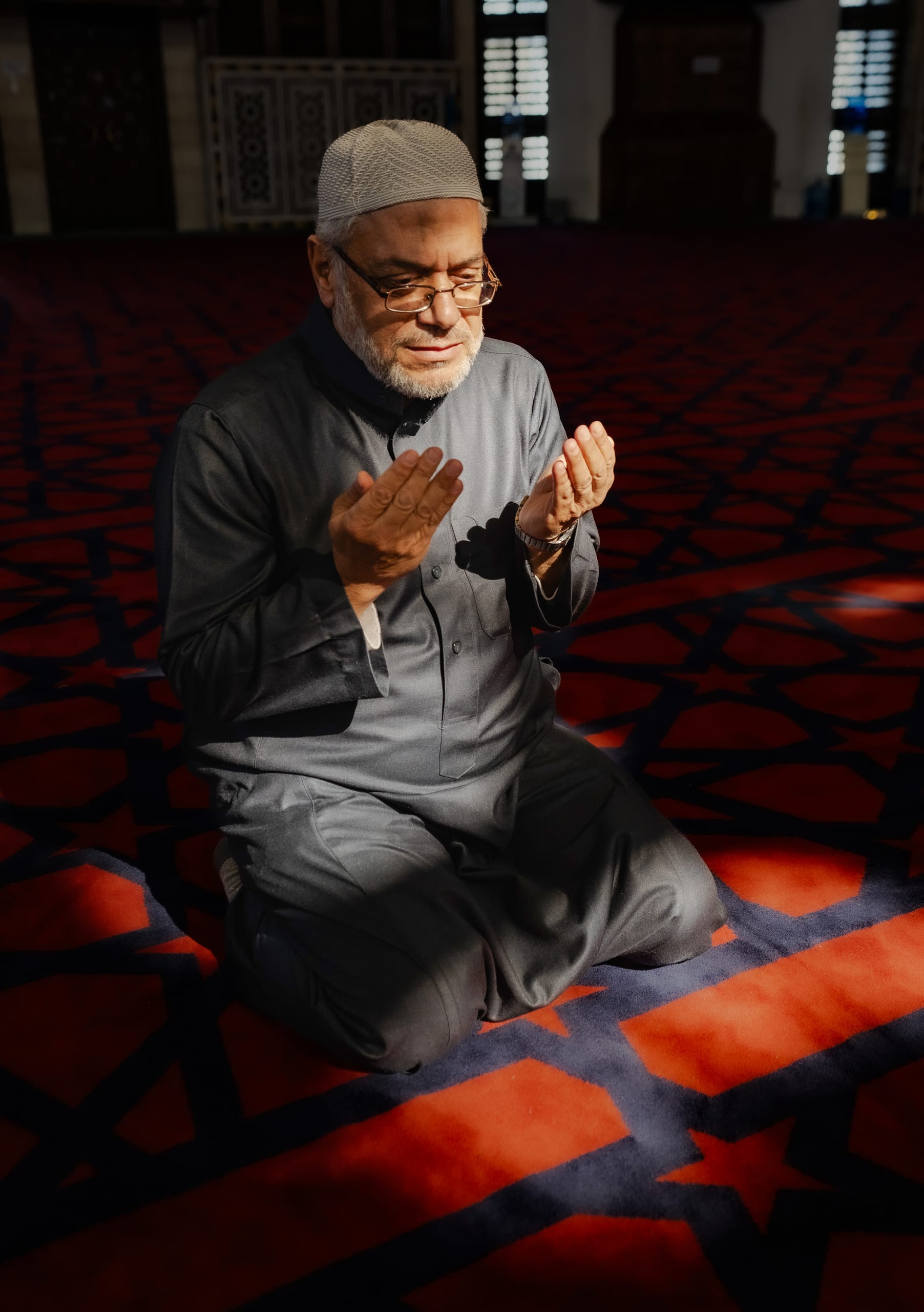 MAN Read Quran Masjid Ramadain, a fine-art photograph by Ali Abu Ras