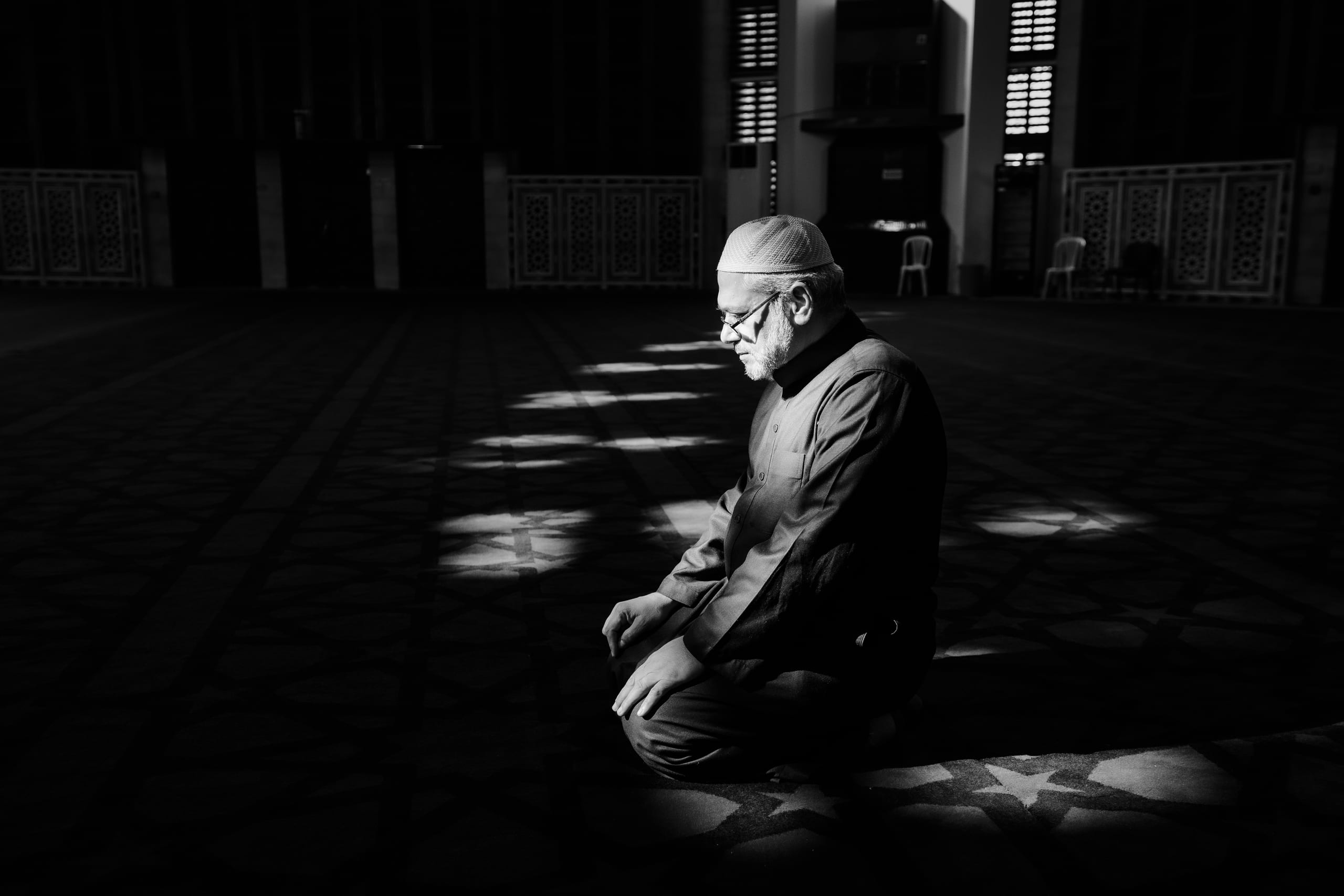 MAN Read Quran Masjid Ramadain, a fine-art photograph by Ali Abu Ras