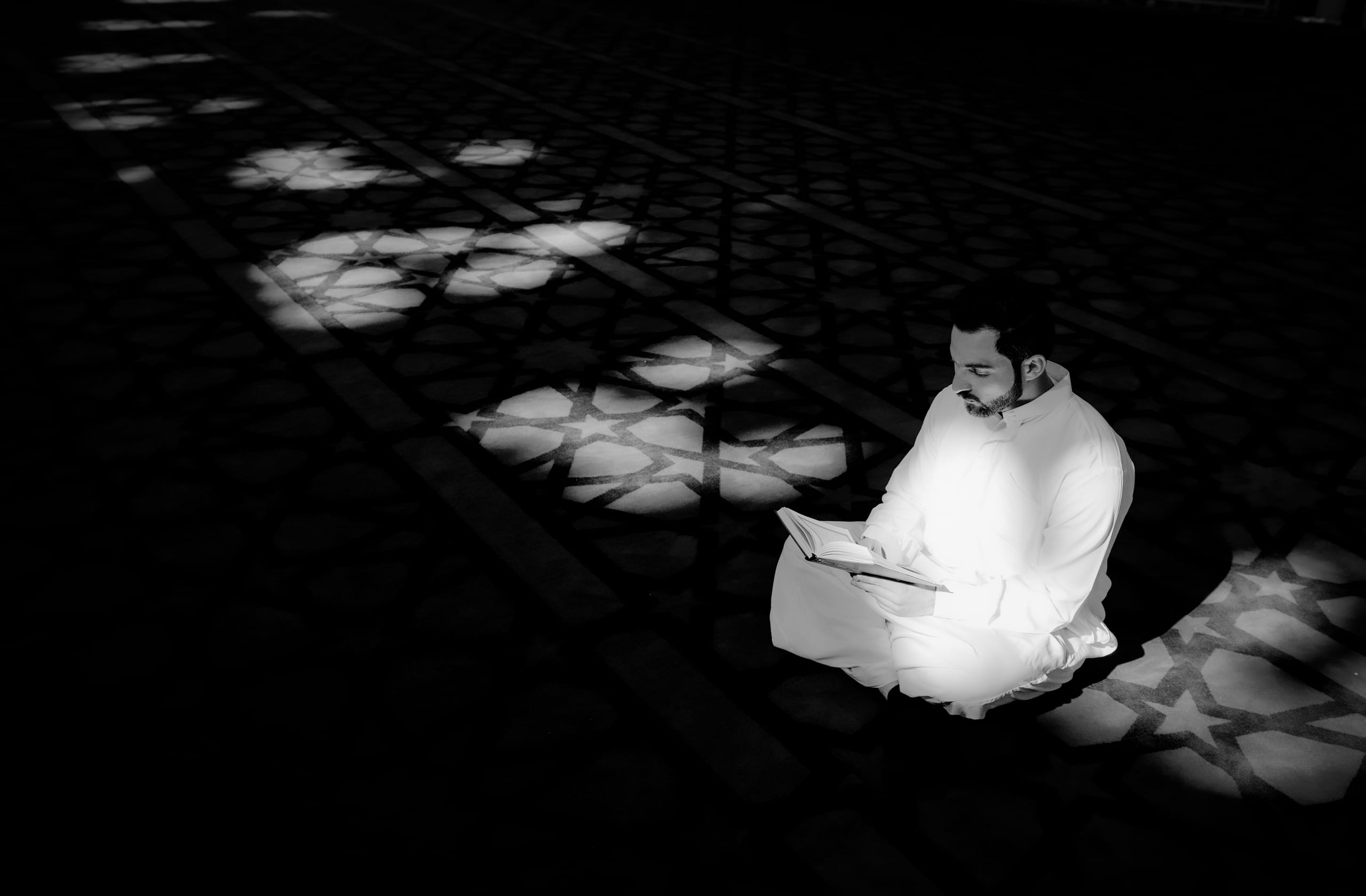 MAN Read Quran Masjid Ramadain, a fine-art photograph by Ali Abu Ras
