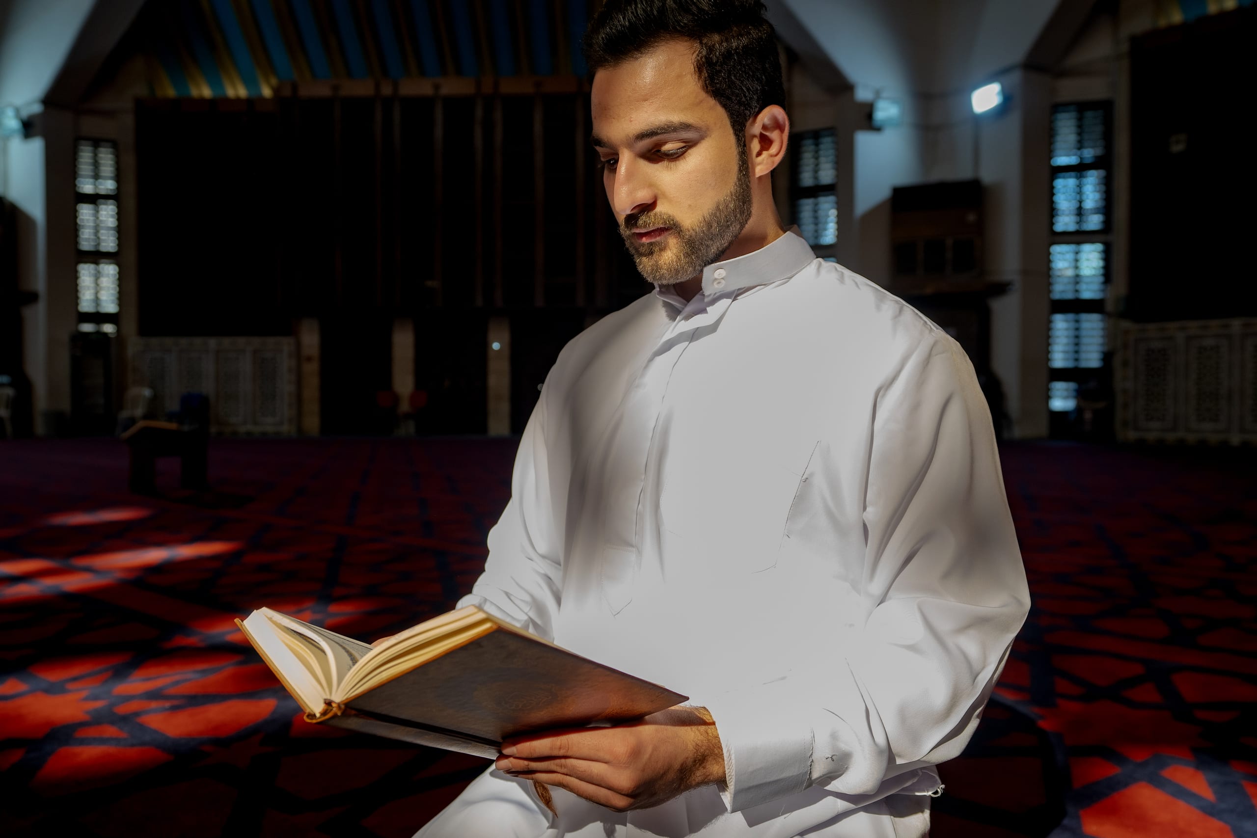 MAN Read Quran Masjid Ramadain, a fine-art photograph by Ali Abu Ras