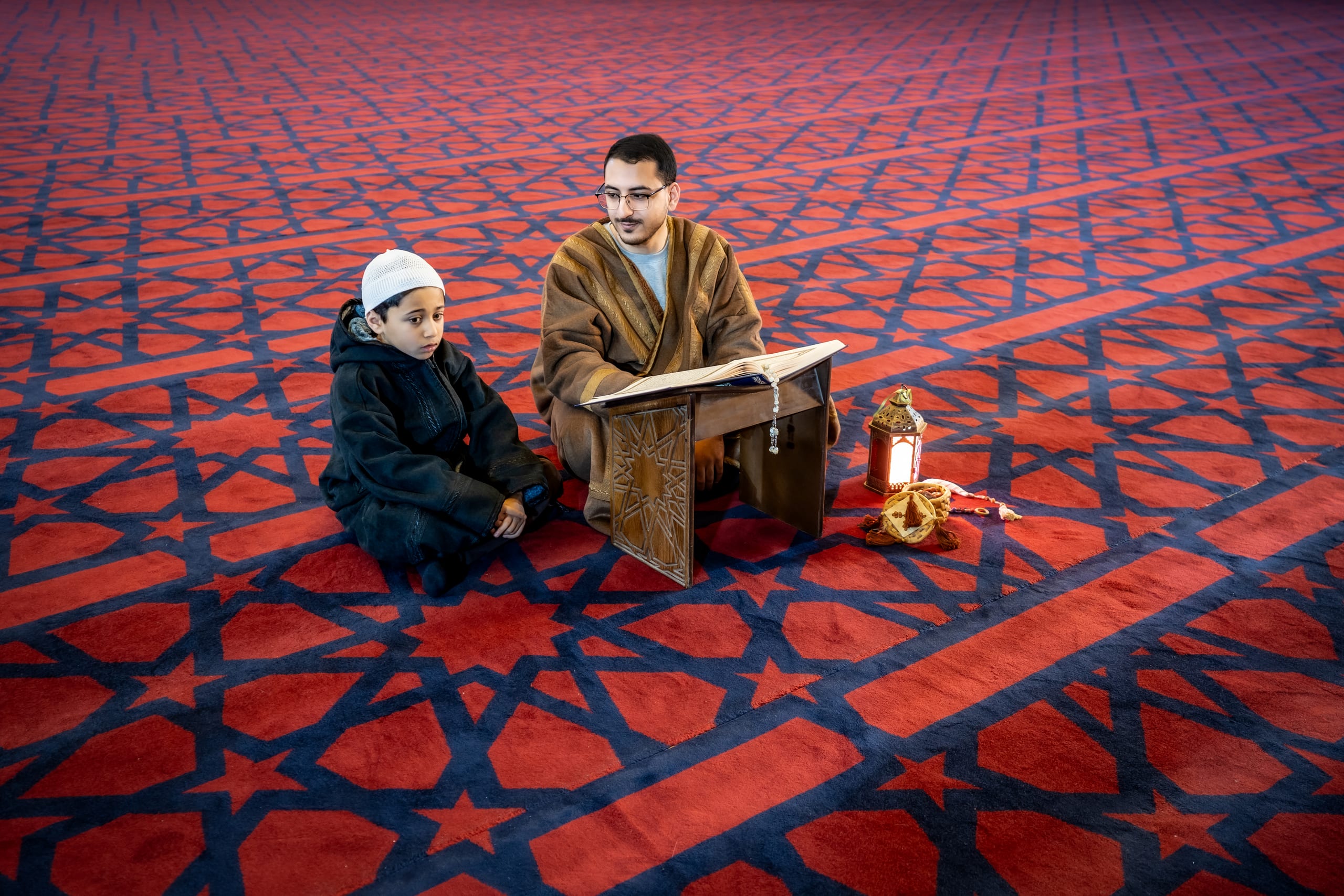 BOY Father Masjed Quran, a fine-art photograph by Ali Abu Ras