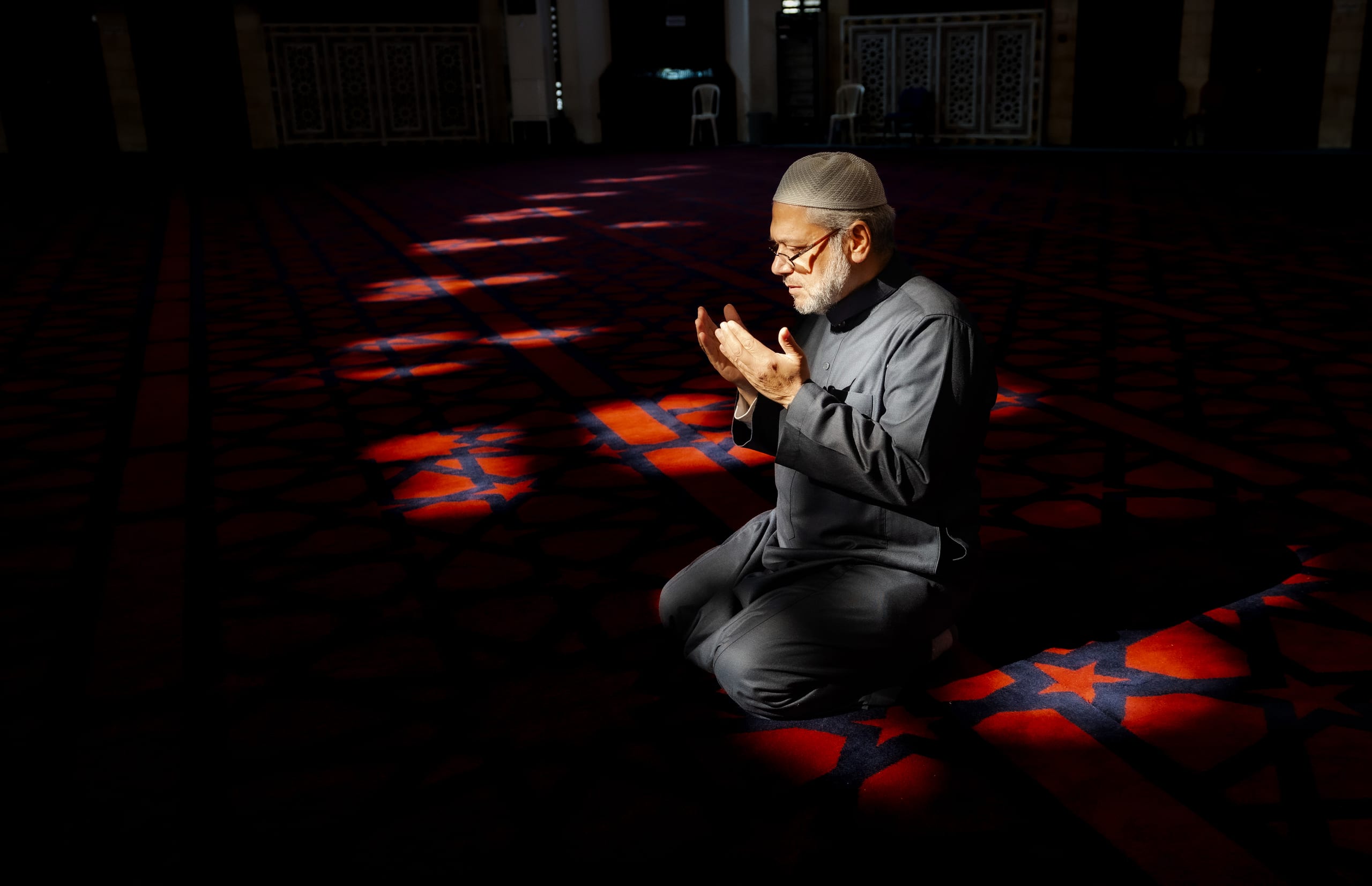 MAN Read Quran Masjid Ramadain, a fine-art photograph by Ali Abu Ras