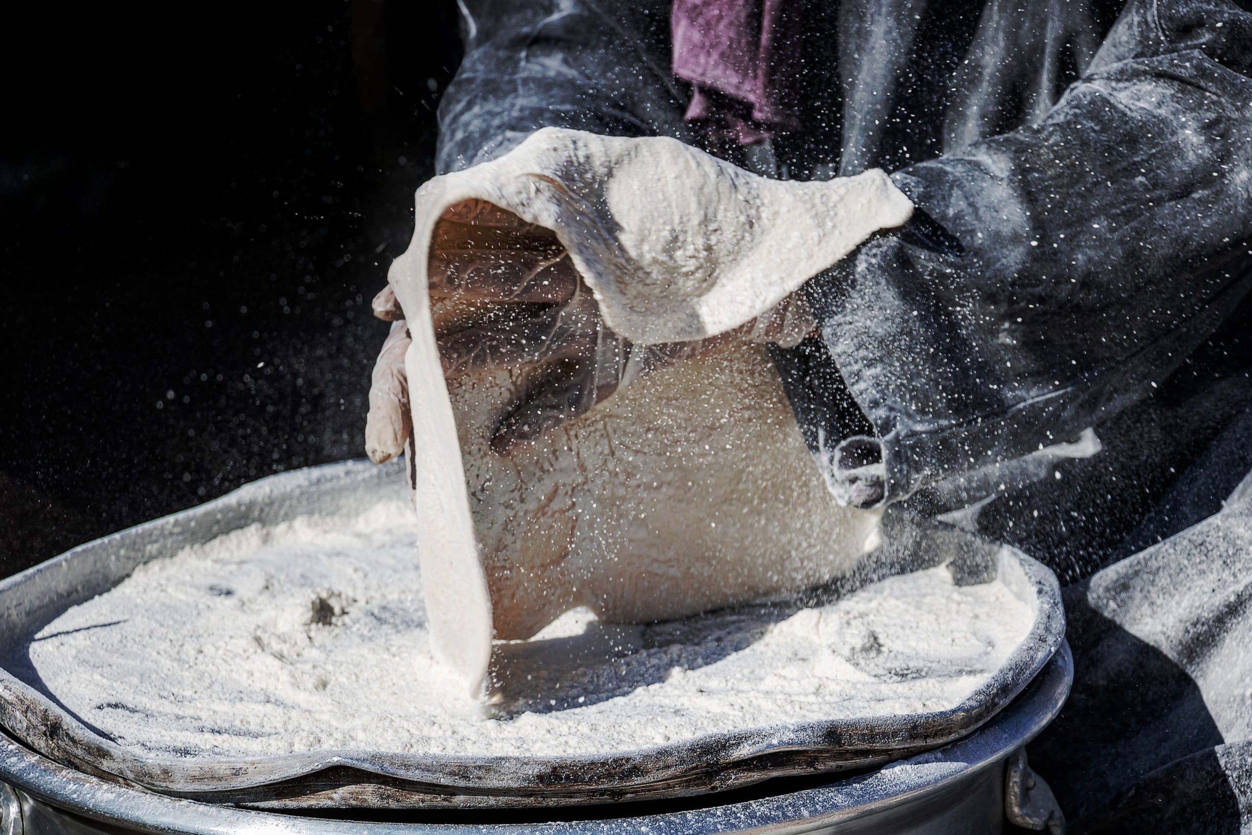 Woman Work Made Bread Graessa, a fine-art photograph by Ali Abu Ras