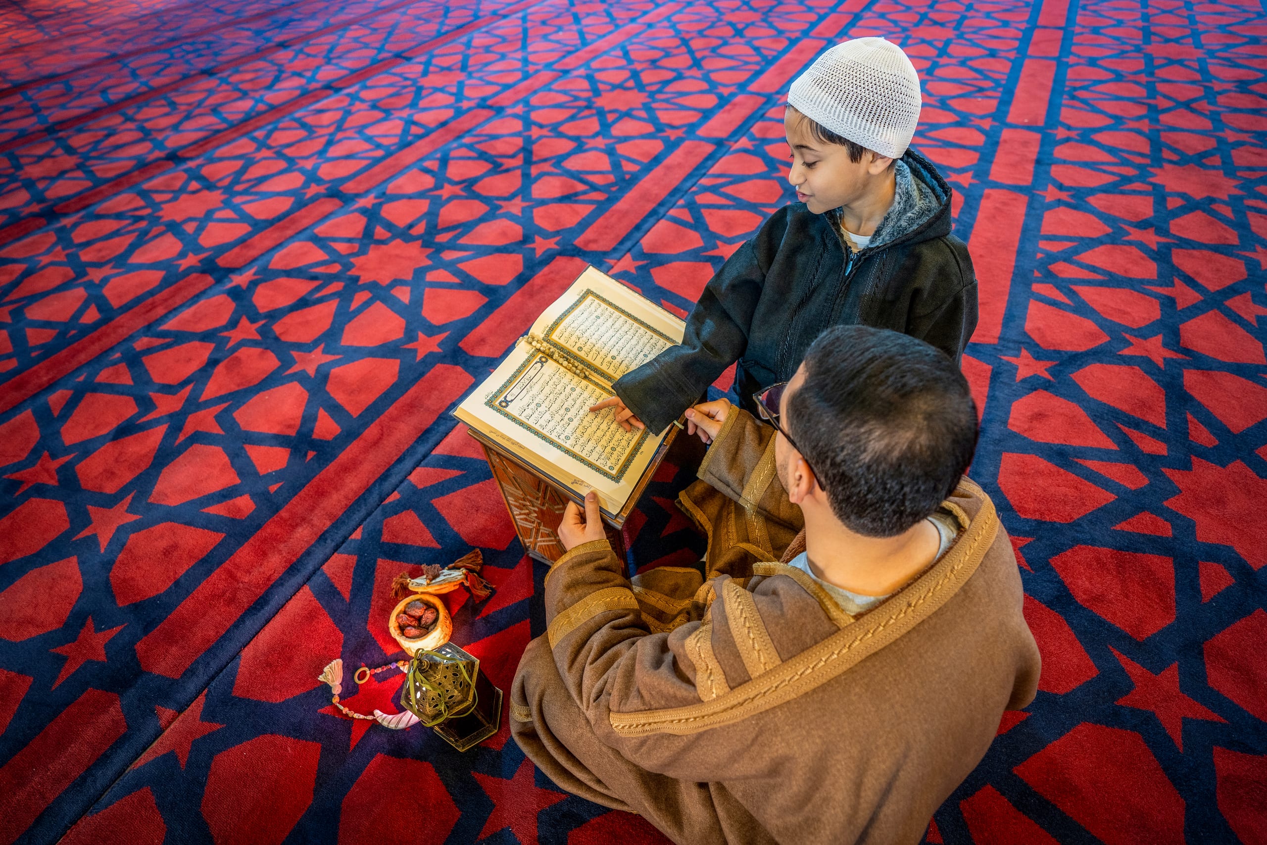BOY Father Masjed Quran, a fine-art photograph by Ali Abu Ras