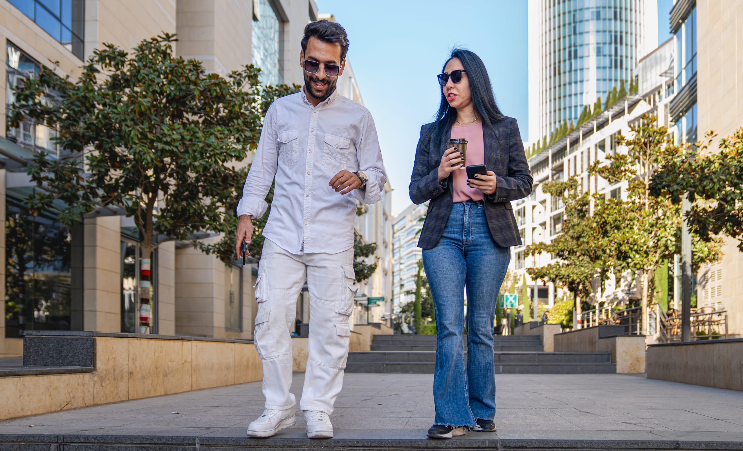 MAN Woman Walking, a fine-art photograph by Ali Abu Ras