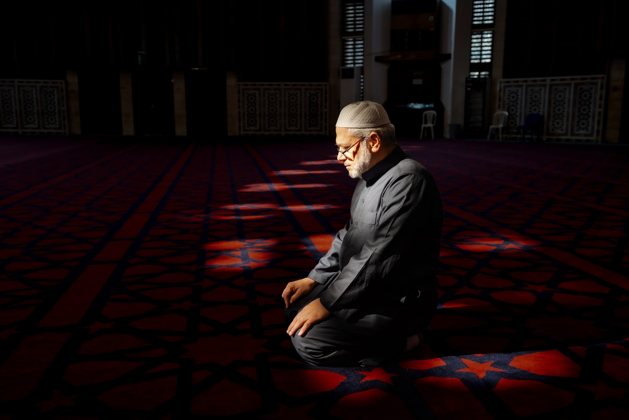MAN Read Quran Masjid Ramadain, a fine-art photograph by Ali Abu Ras