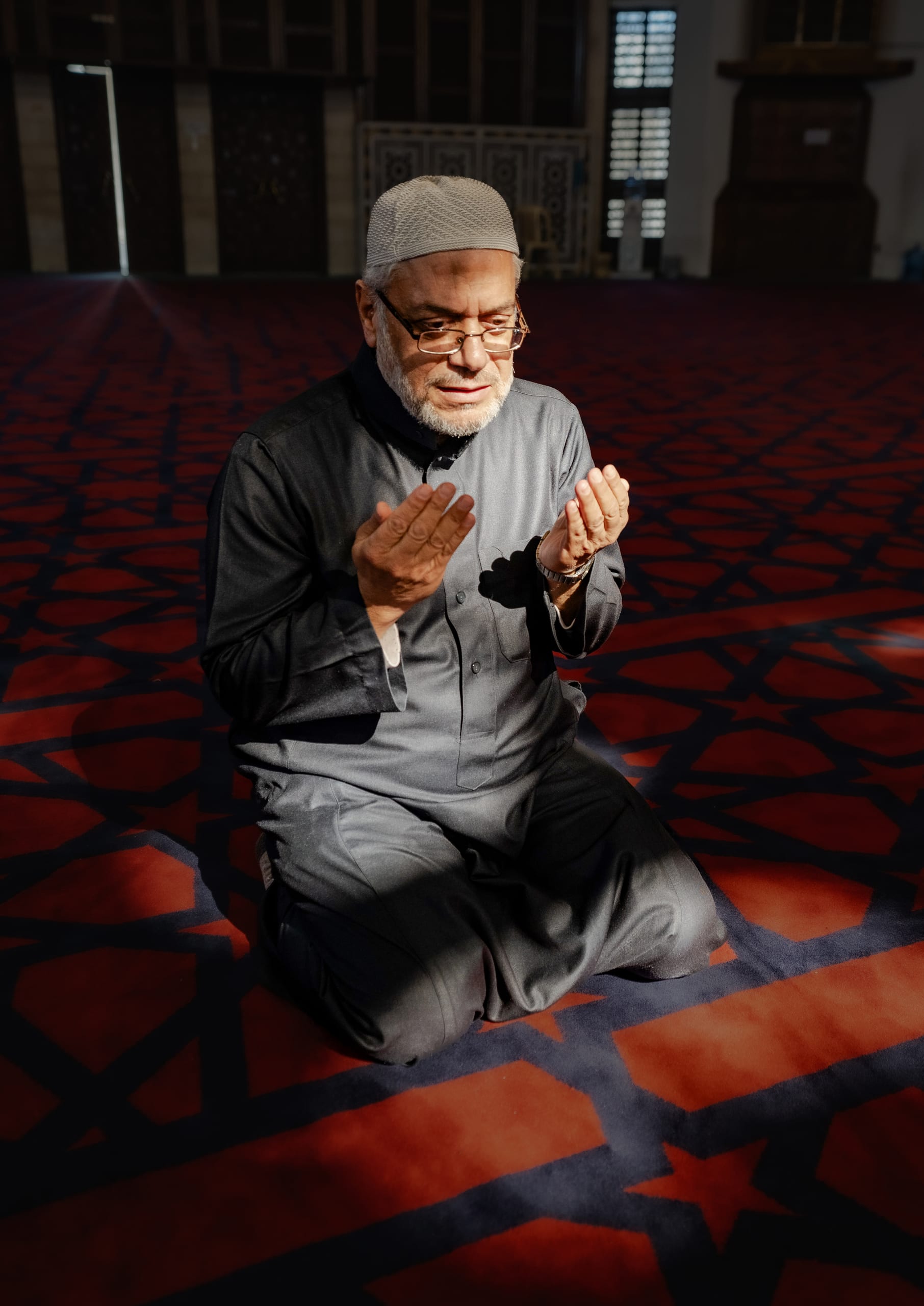 MAN Read Quran Masjid Ramadain, a fine-art photograph by Ali Abu Ras