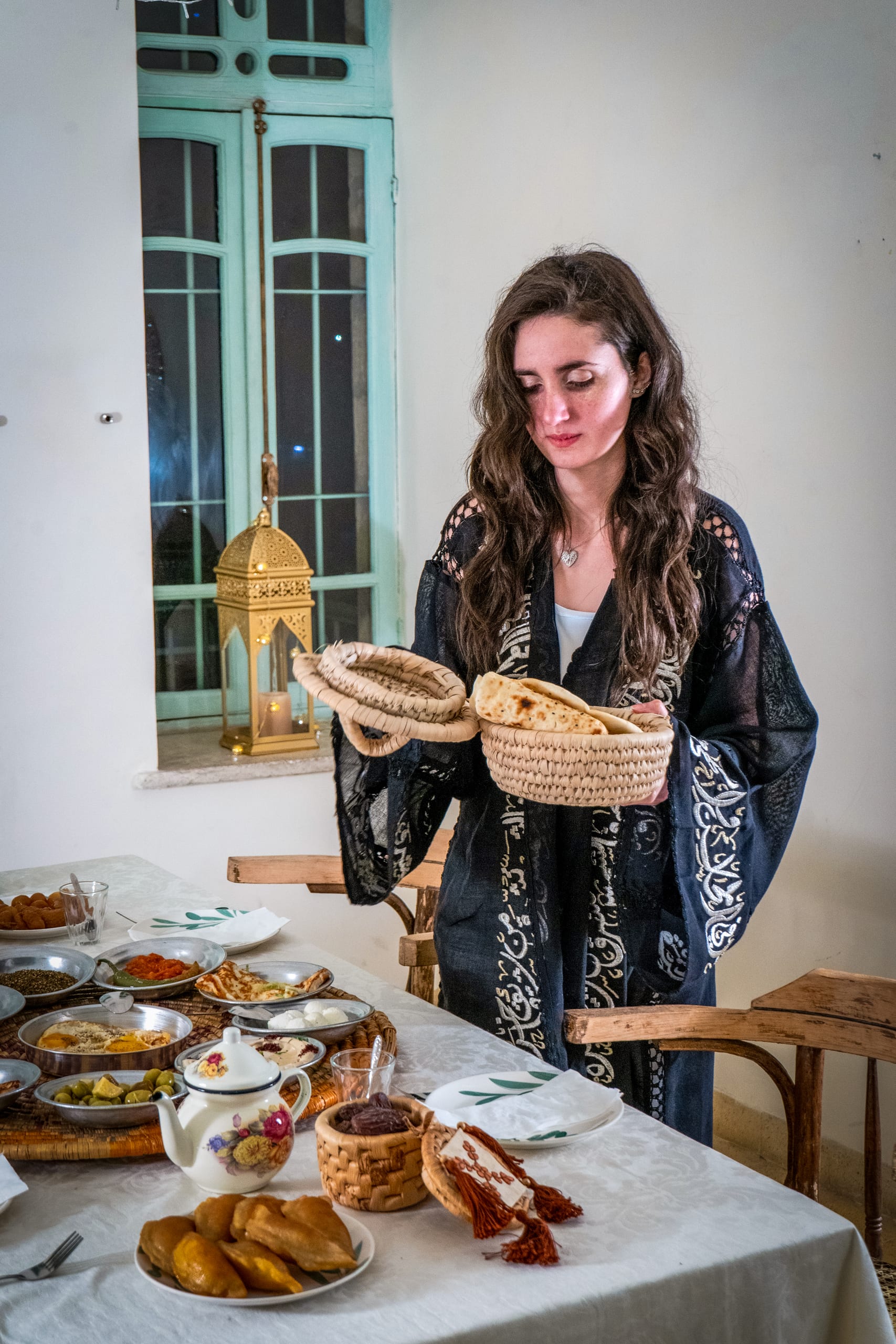 Ramadan Woman Noor Eftar Sohour, a fine-art photograph by Ali Abu Ras